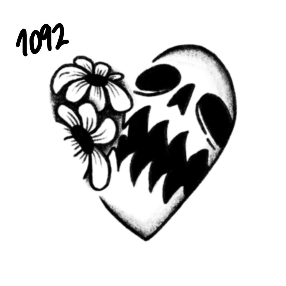 A tattoo design of a heart with a snarling monster face with sharp teeth and two flowers on the upper left side of the heart, with the number 1092 handwritten above the flowers.