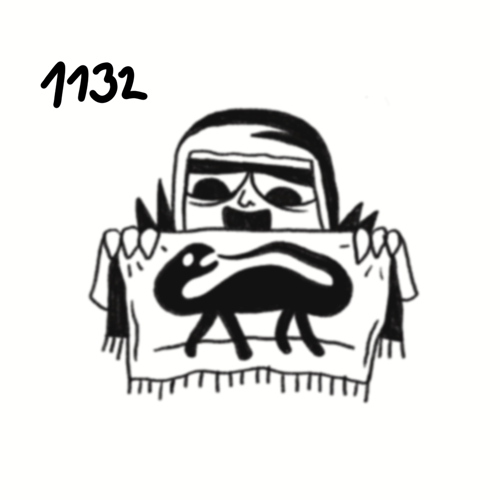 A child with glasses holding up a drawing of a black dog on a white cloth with a fringed border.