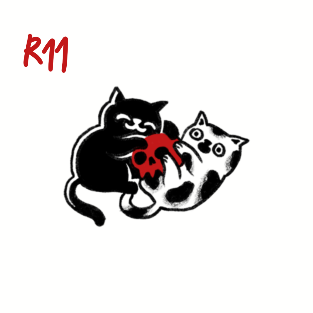 Cartoon illustration of a black cat and a calico cat fighting over a red skull, with "R11" written in red in the top left corner.