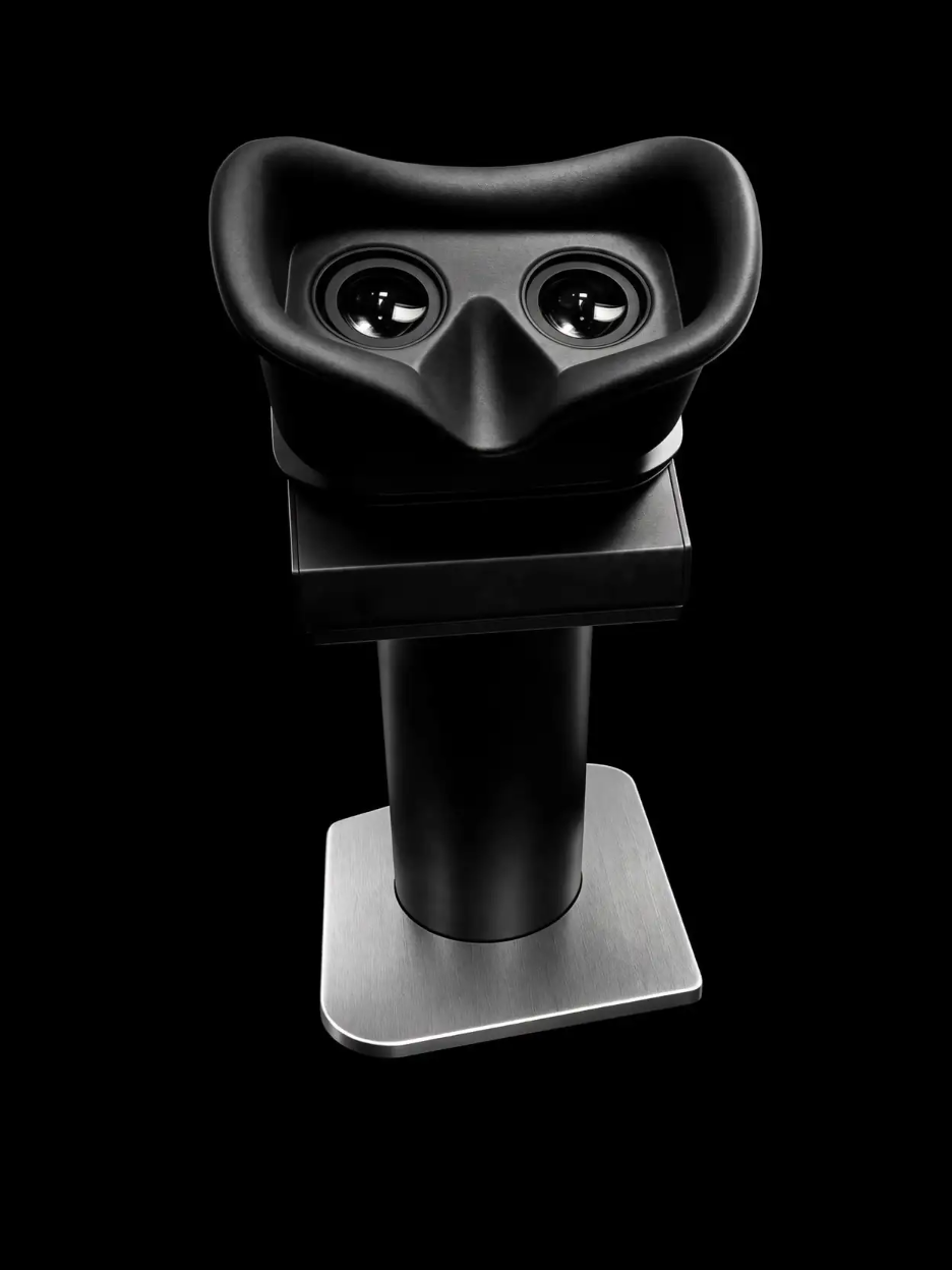 A black virtual reality headset with binocular lenses displayed on a black background.
