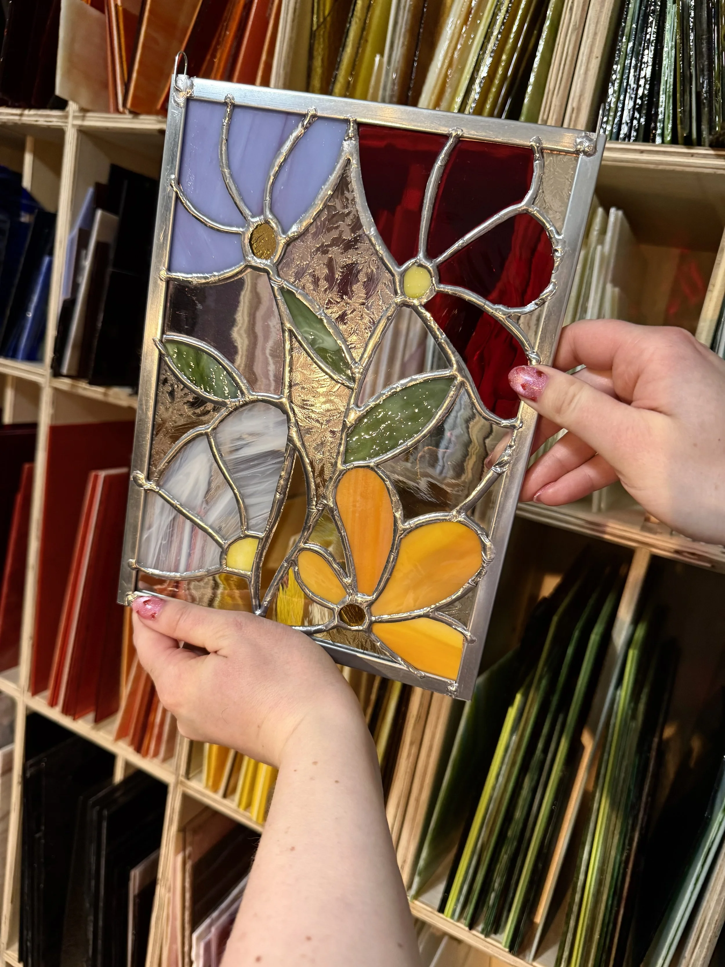 Photo of a finished Flower stained glass artwork.
