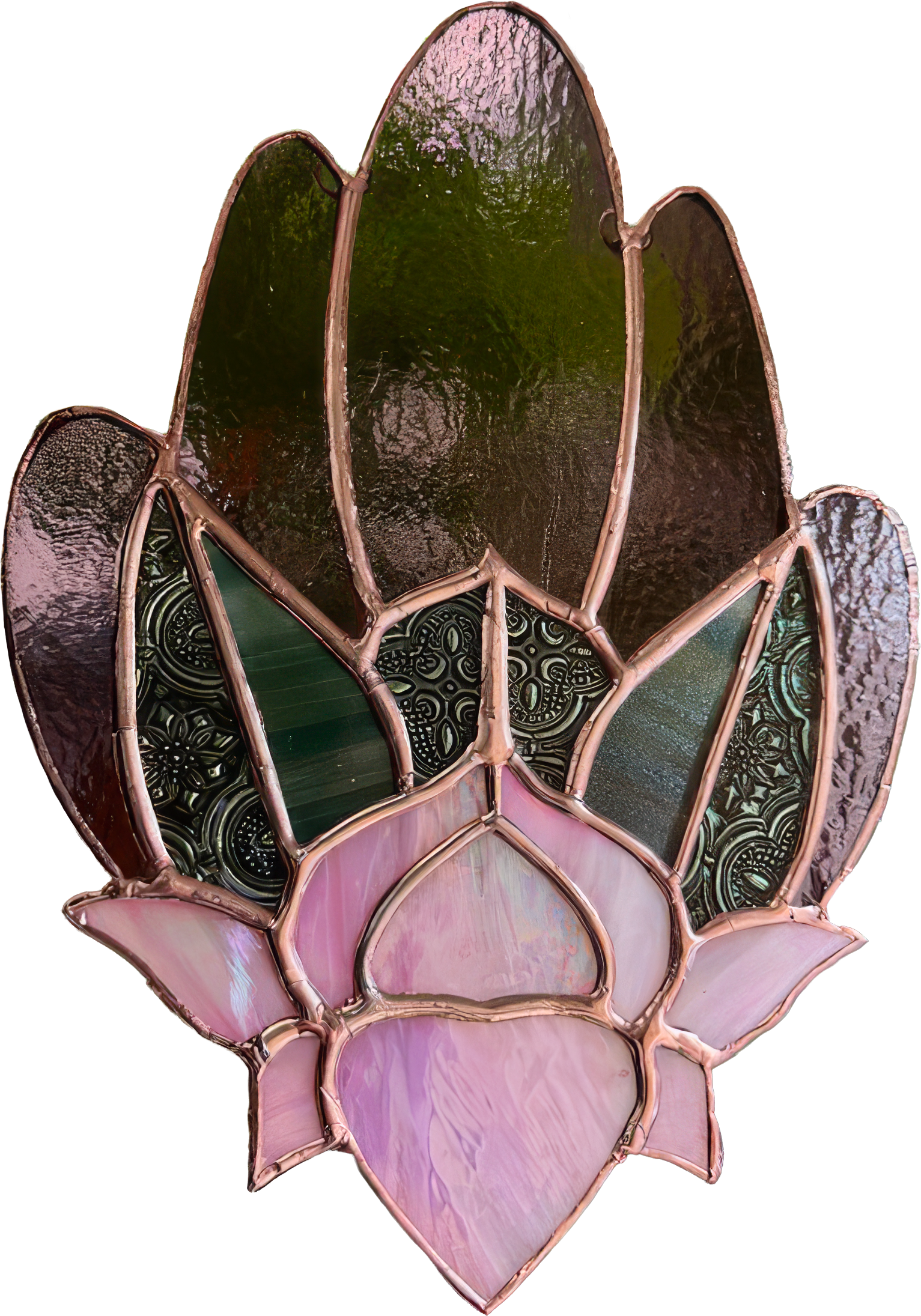 A close-up of a stained glass lamp with pink, green, and patterned glass pieces arranged in a floral hamsa design.