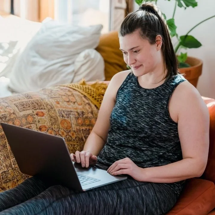 Woman participating in virtual EMDR therapy from a private space.