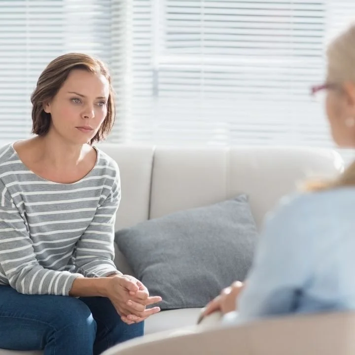 Client discussing trauma recovery with a therapist during an evidence-based trauma treatment session in NYC.