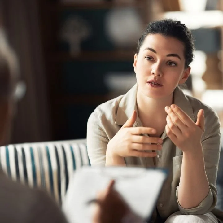Patient discussing trauma symptoms during an evidence-based therapy session.