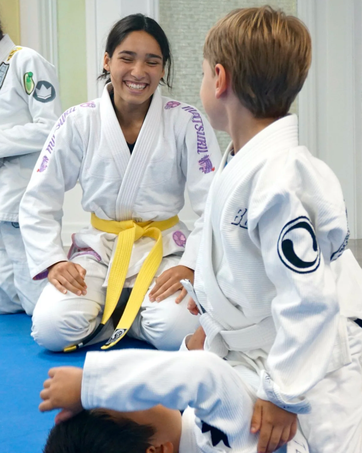 A young student smiling during Jiu-Jitsu practice