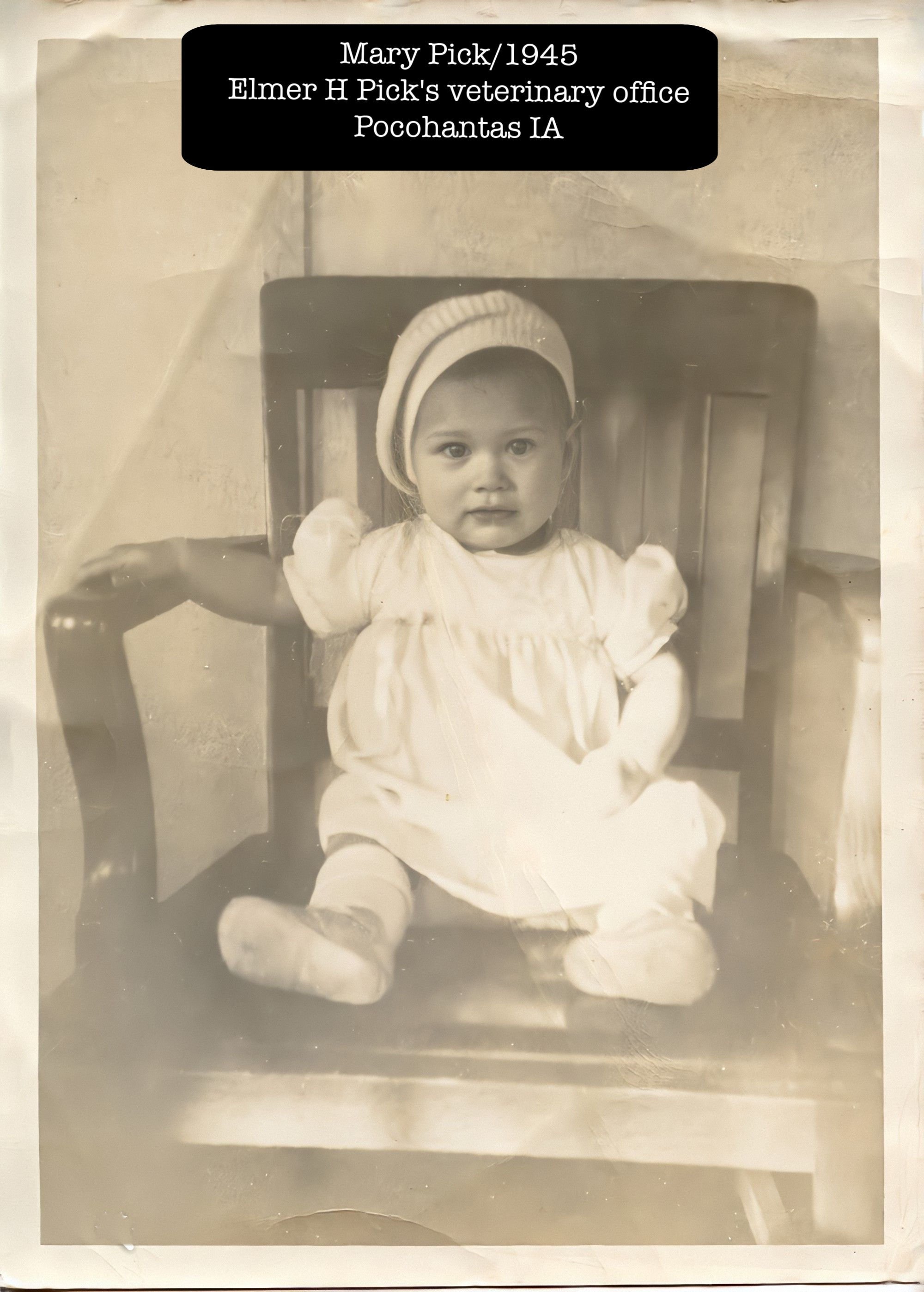 Baby Mary in her dad's chair