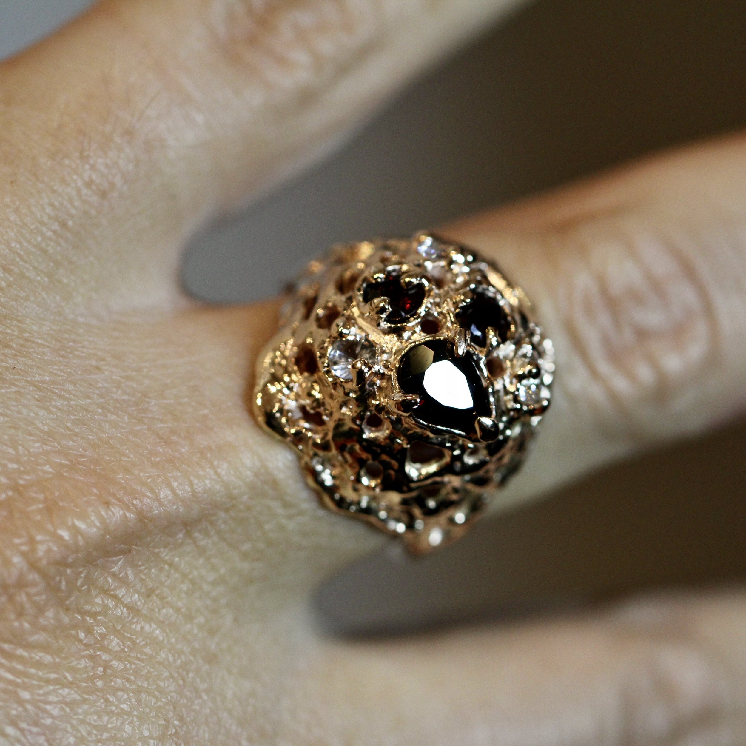 Repurposed gold and pyrope garnet with added white sapphires