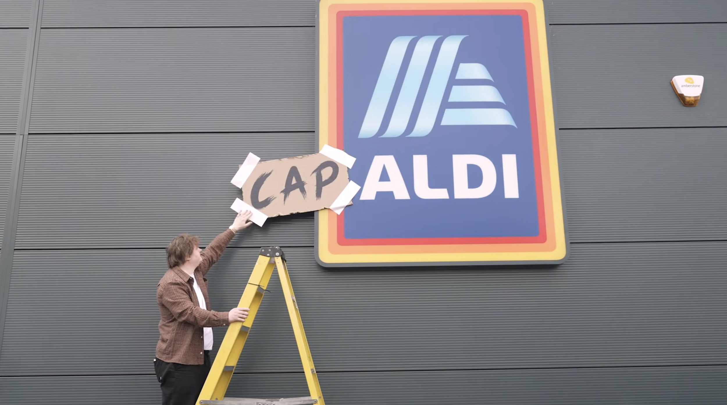 Lewis CapALDI performs secret gig on a supermarket