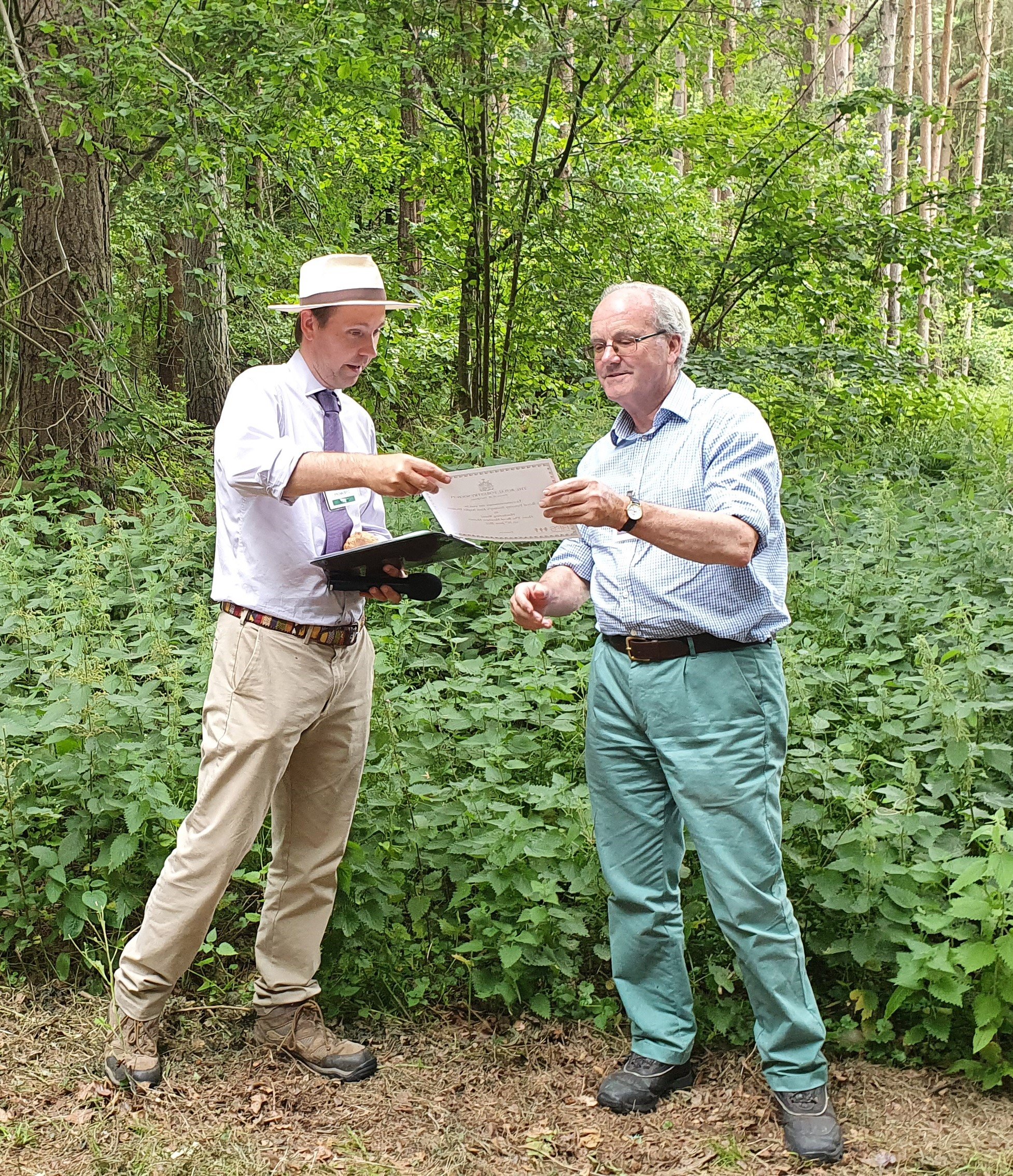 Matthew Hutton receiving a certificate from RFS chairman Ed Fitzalan-Howard