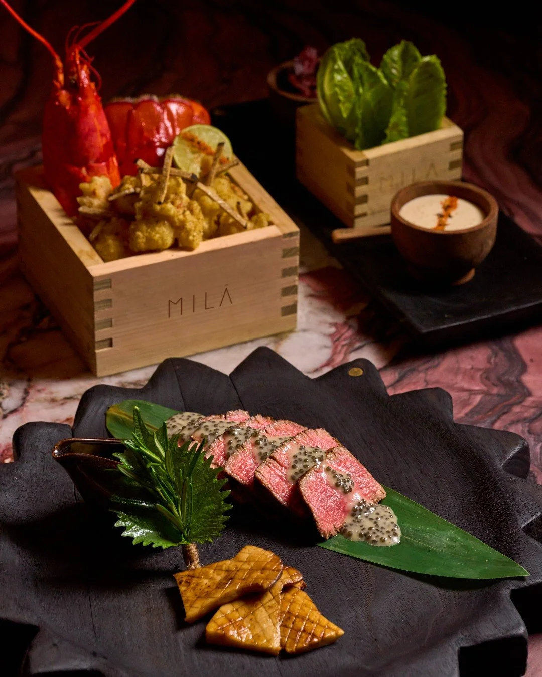 Celebrate Christmas at MILA with our festive specialty dish perfect for gathering and celebrating with loved ones. Indulge in our 7oz creekstone tenderloin paired with maine lobster tempura topped with smoked maldon salt and imperial sake caviar beur