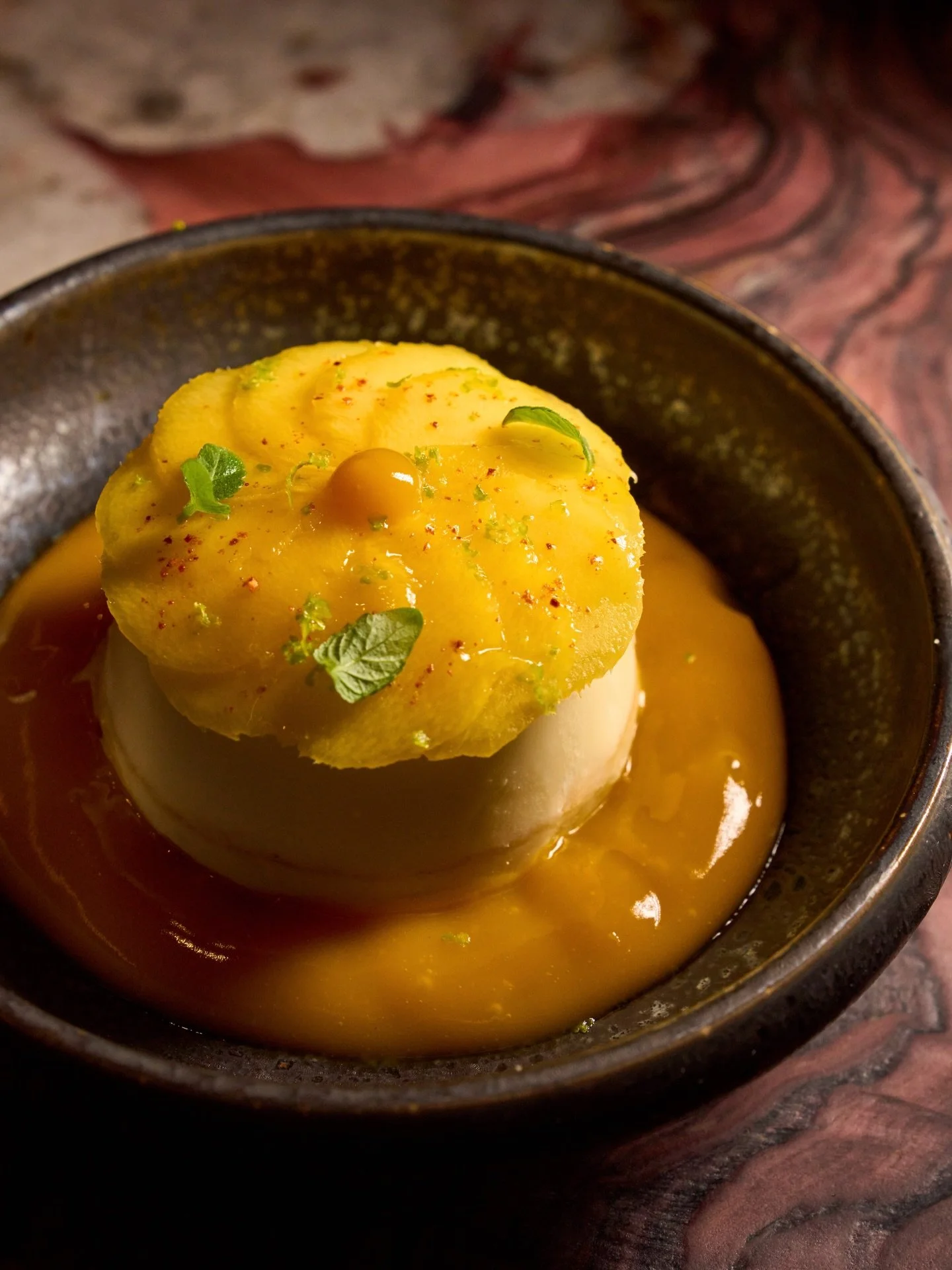 Discover our newest dessert menu addition, Yuzu Blossom Panna Cotta. Sweet, bright, and perfectly balanced with mango coulis, sudachi zest, and mirliton ✨