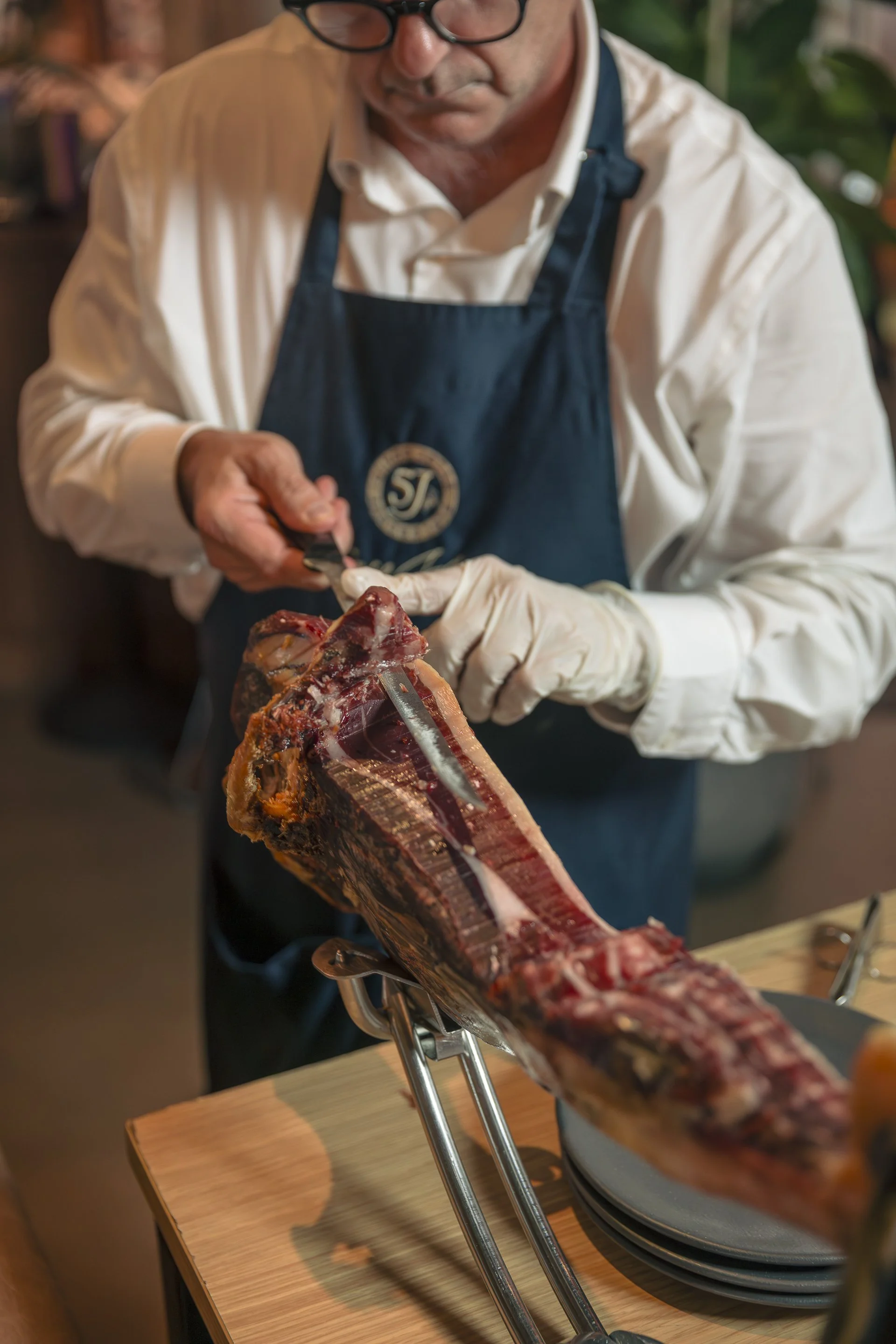 A part of MILA's brunch experience, with taking meat off the bone for guests.