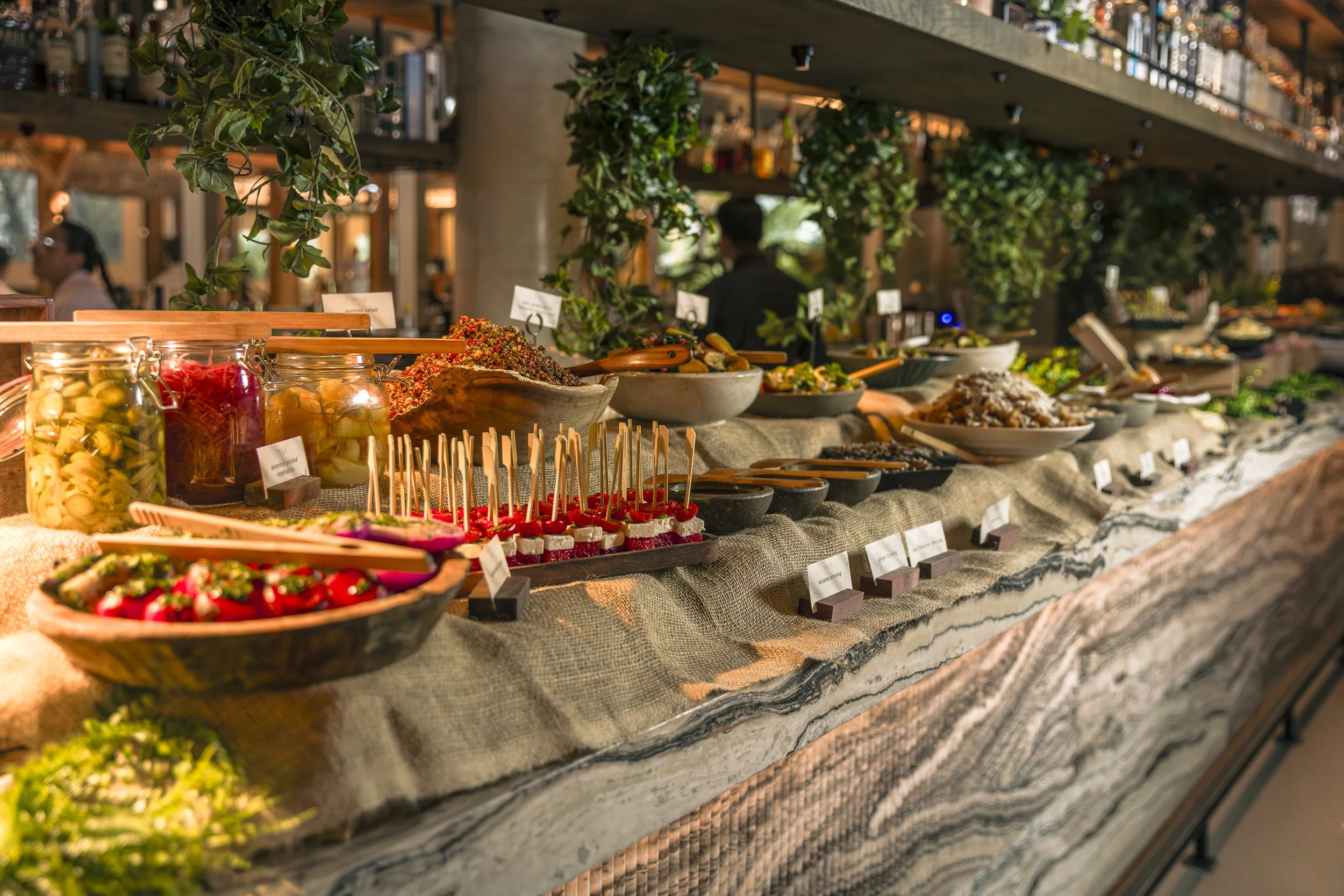 MILA's brunch buffet with multiple dishes on display.
