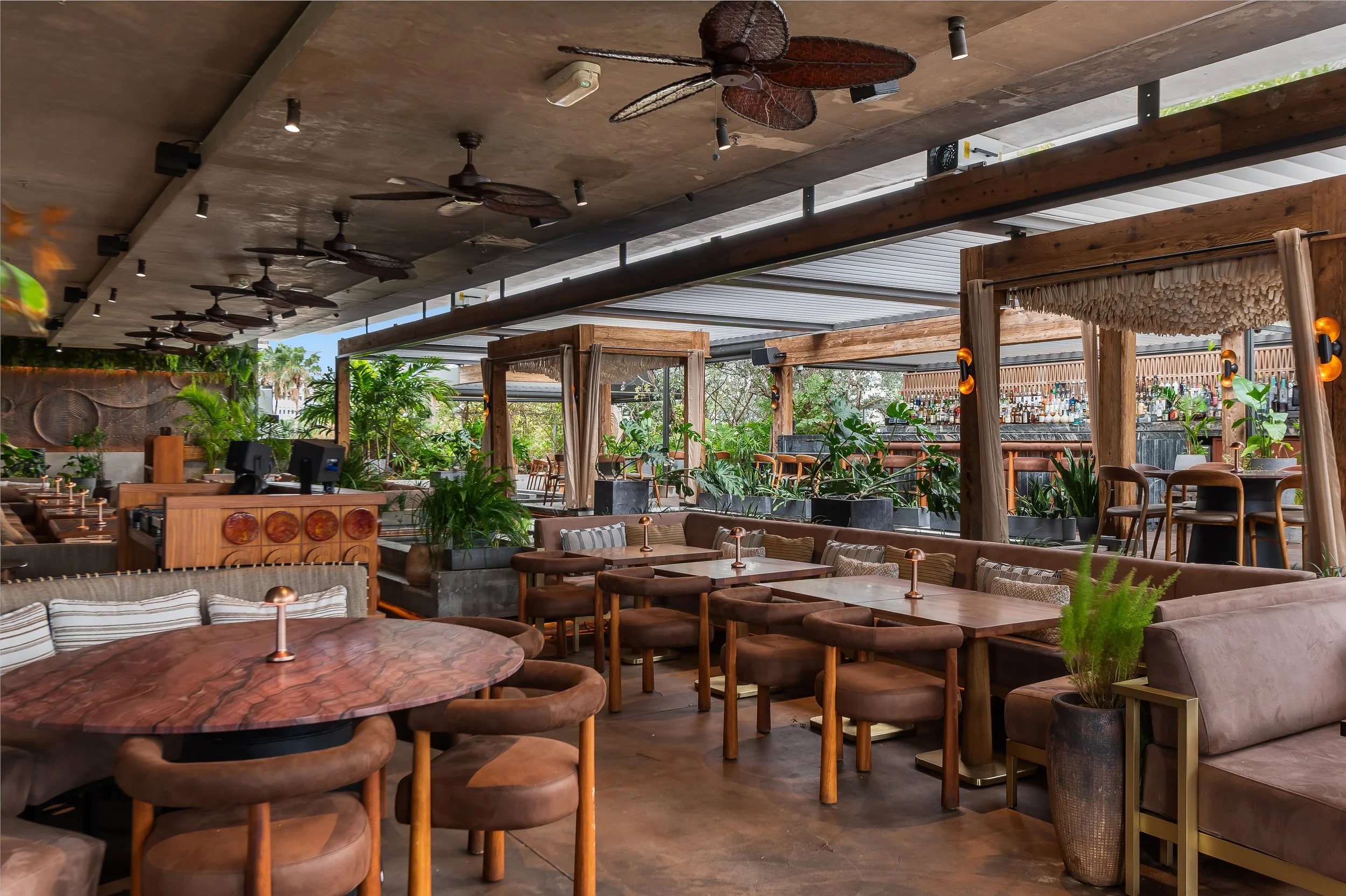 Outside dining view of MILA looking toward the outdoor spaces/rooftop terrace