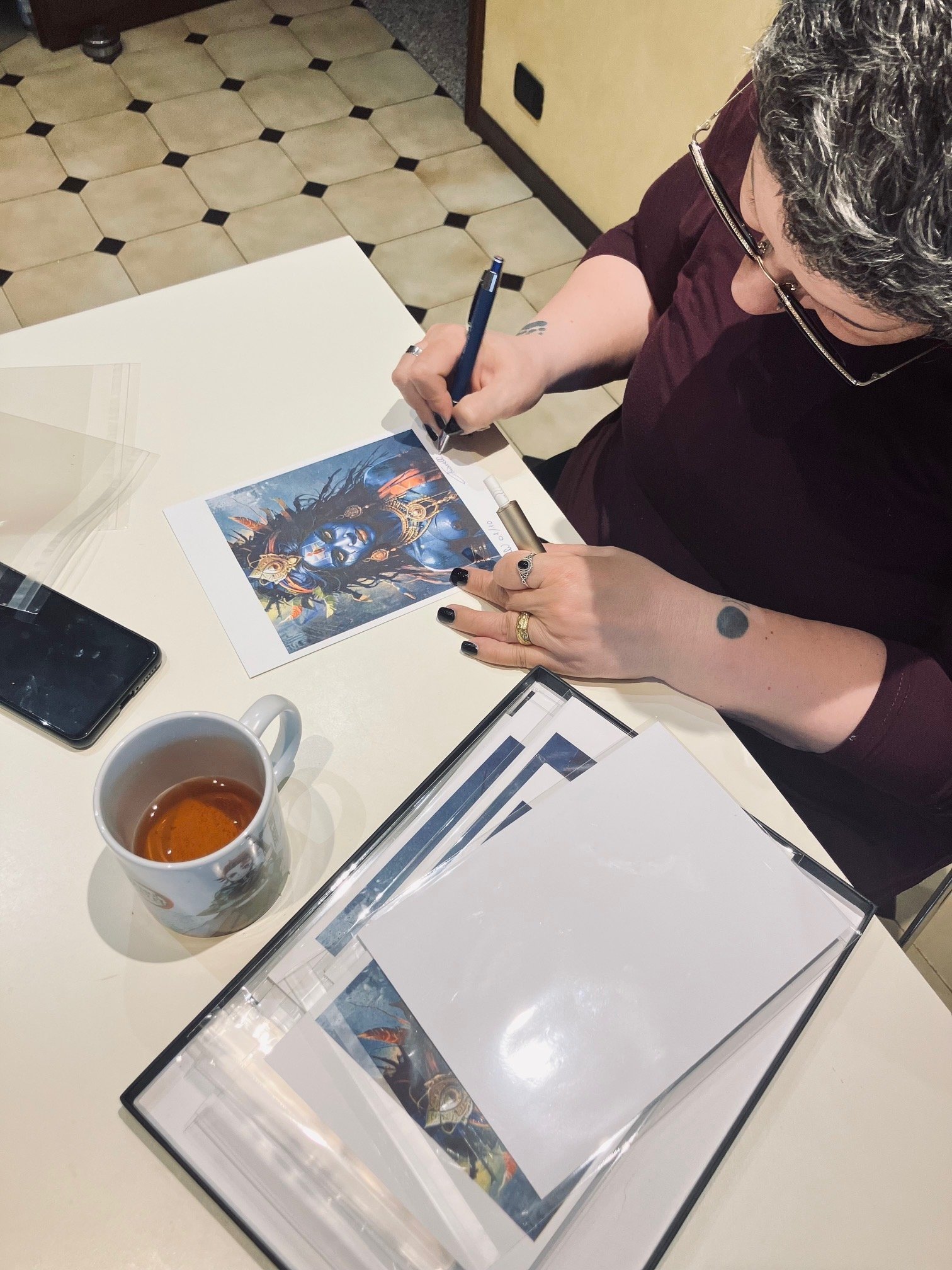 Michela Chiarelli signing each copy