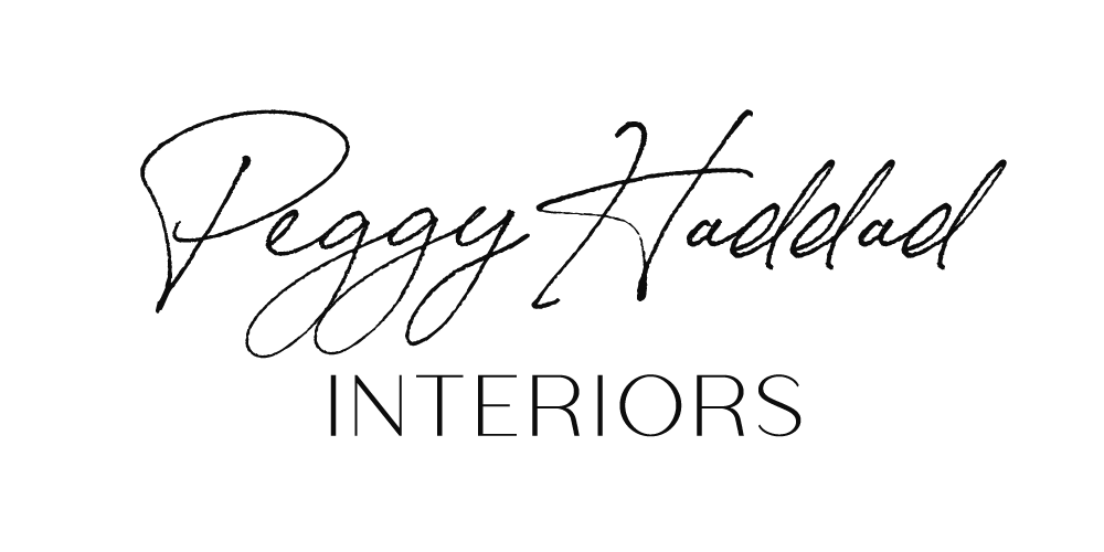 Logo for Peggy Staskal Interiors with signature-style text above the word INTERIORS.
