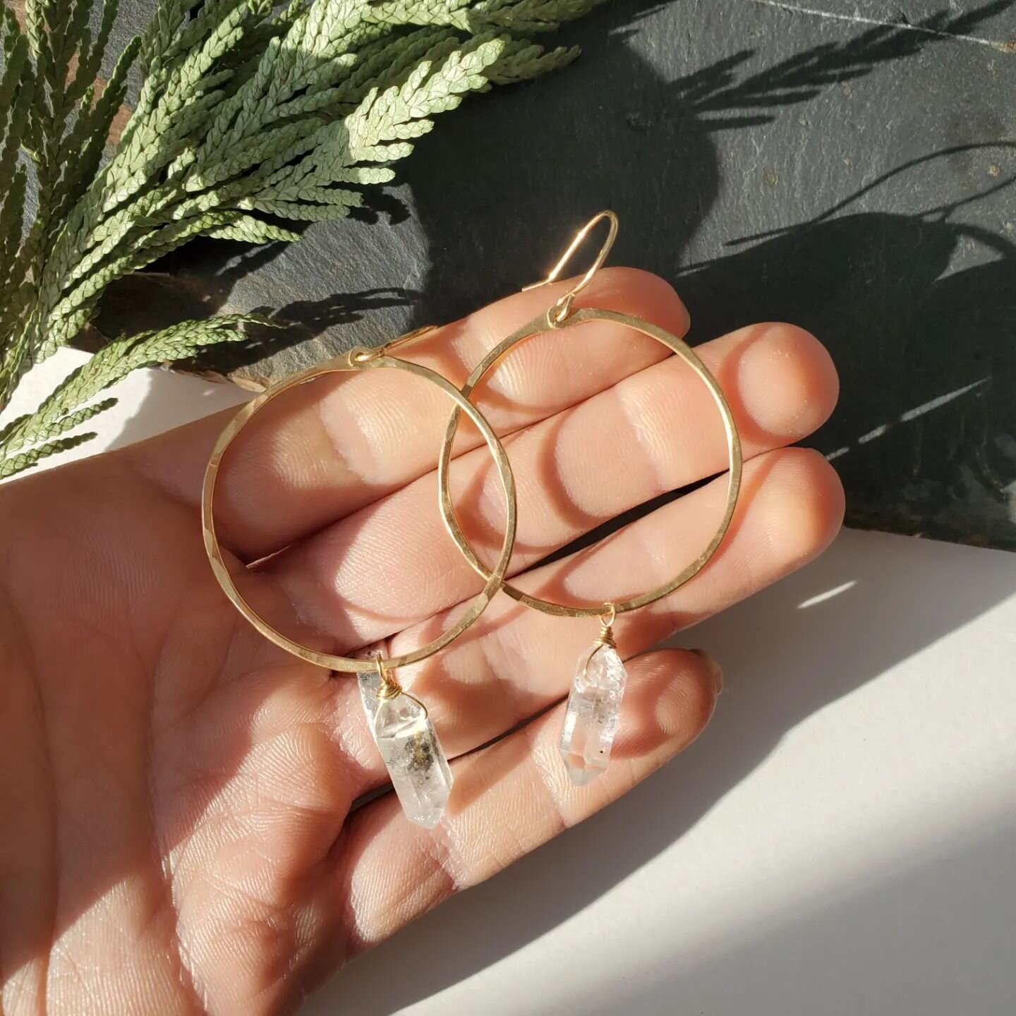 14k gold-filled hoops, hand hammered with Tibetan quartz point crystals 💃 (on my website) :)
