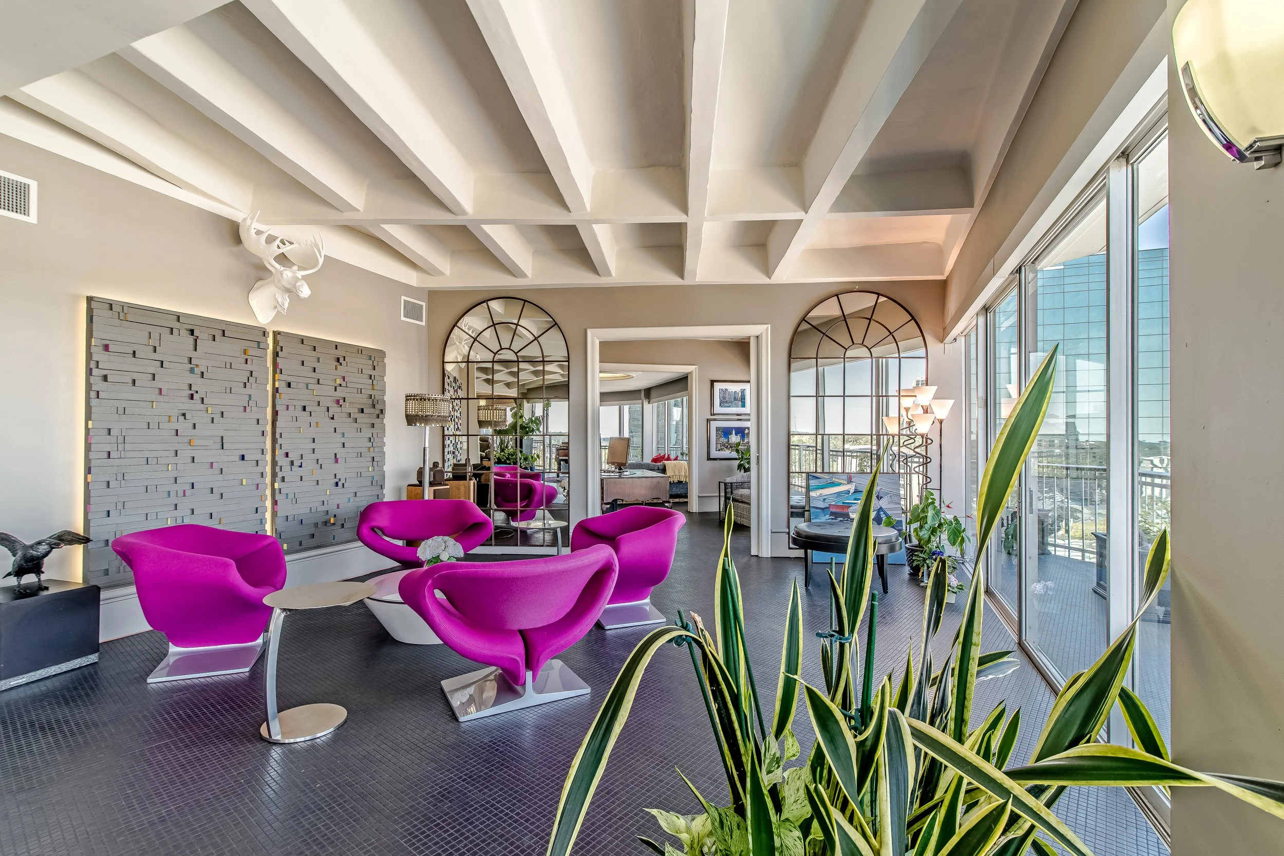 Fuchsia ribbon chairs in luxurious Houston high-rise condo 