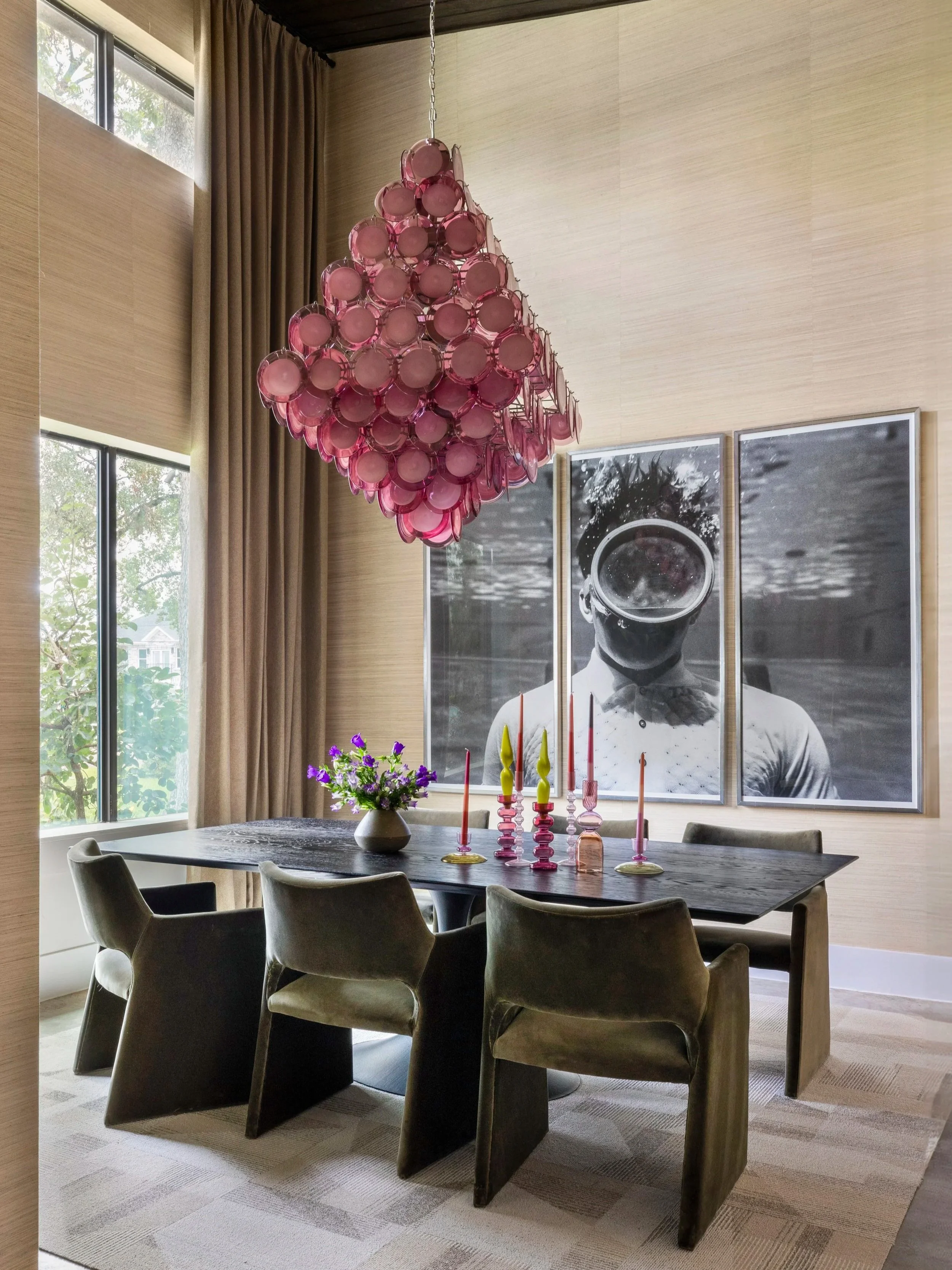 a pink murano glass chadelier hanging in a houston dining room
