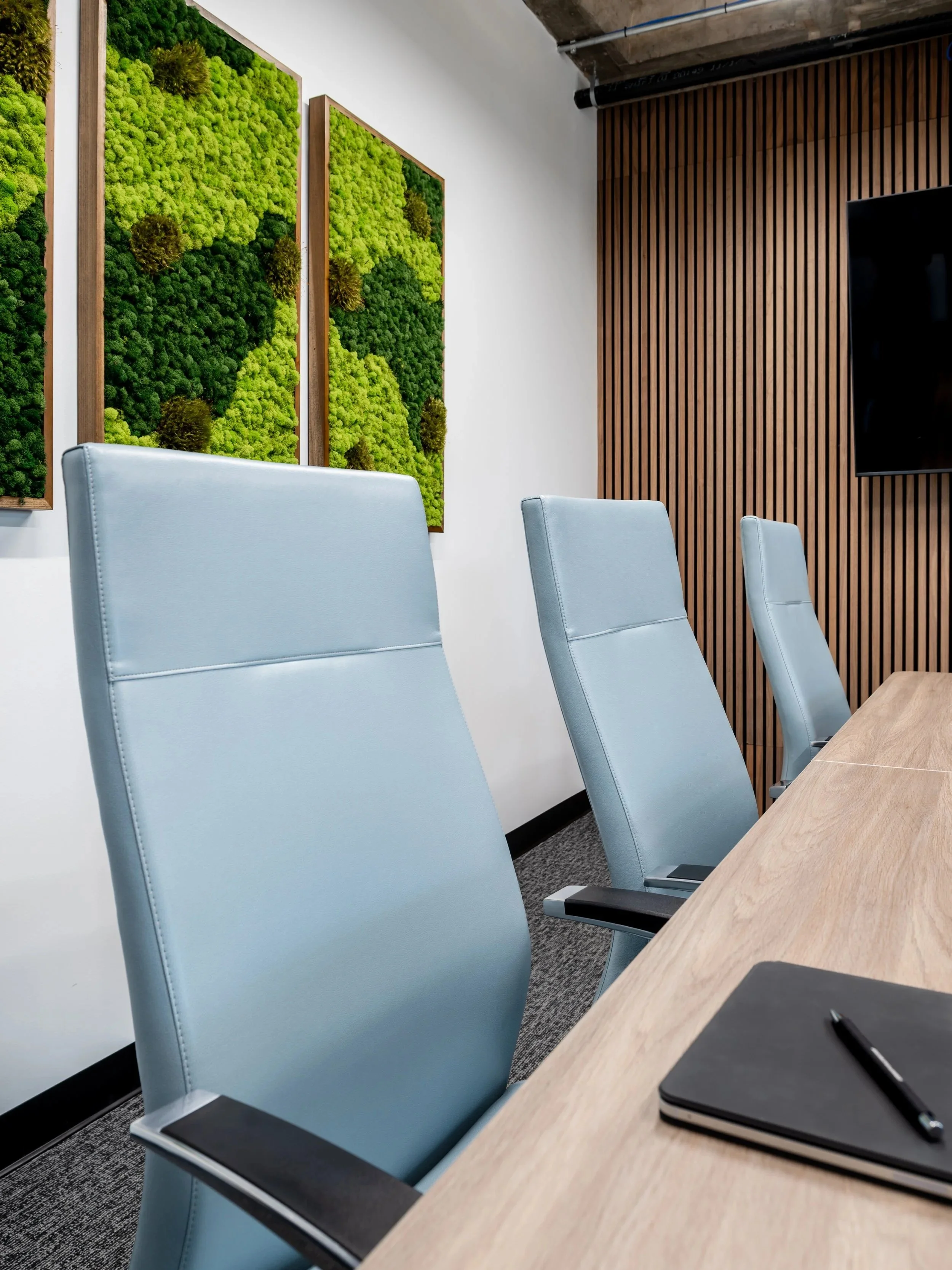 blue leather chairs in a corporate office