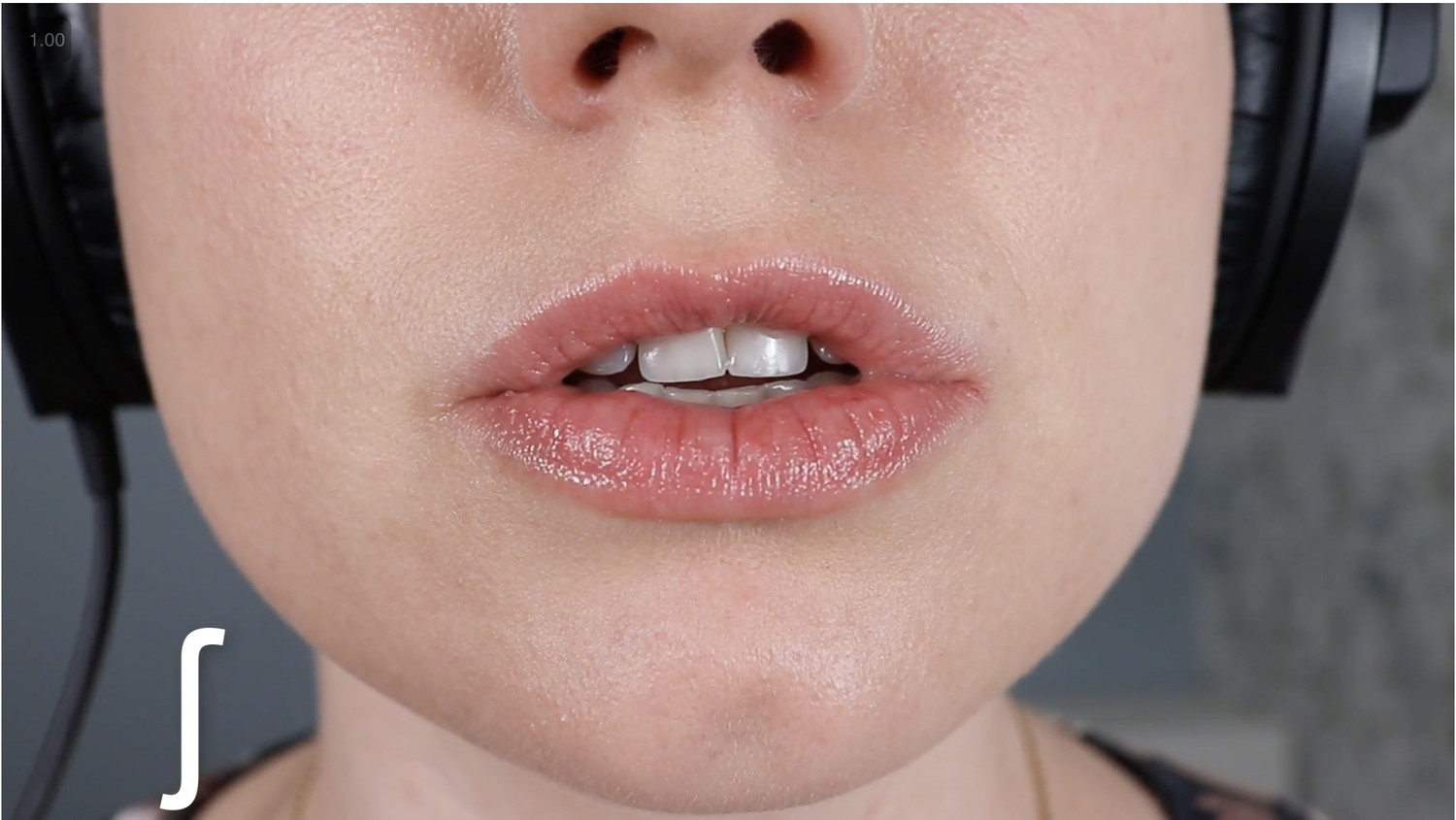 Close-up of Stefanie's mouth forming the /sh/ sound