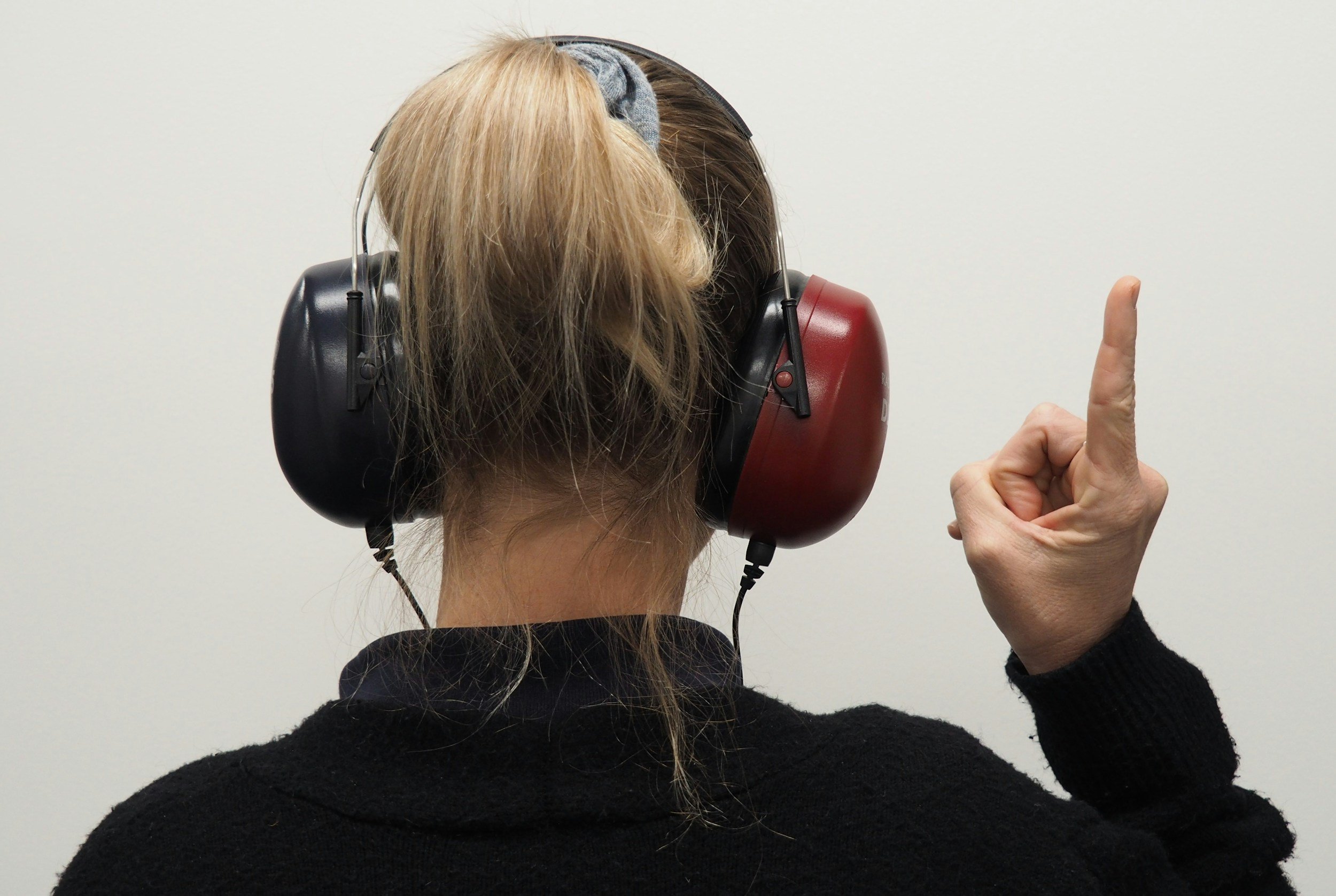 Person wearing hearing protection for World Hearing Day and hearing health awareness