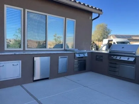 Outdoor kitchen with built-in grills and storage