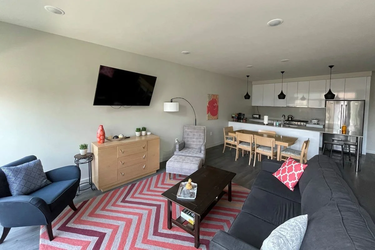 Open concept living room and kitchen common area.
