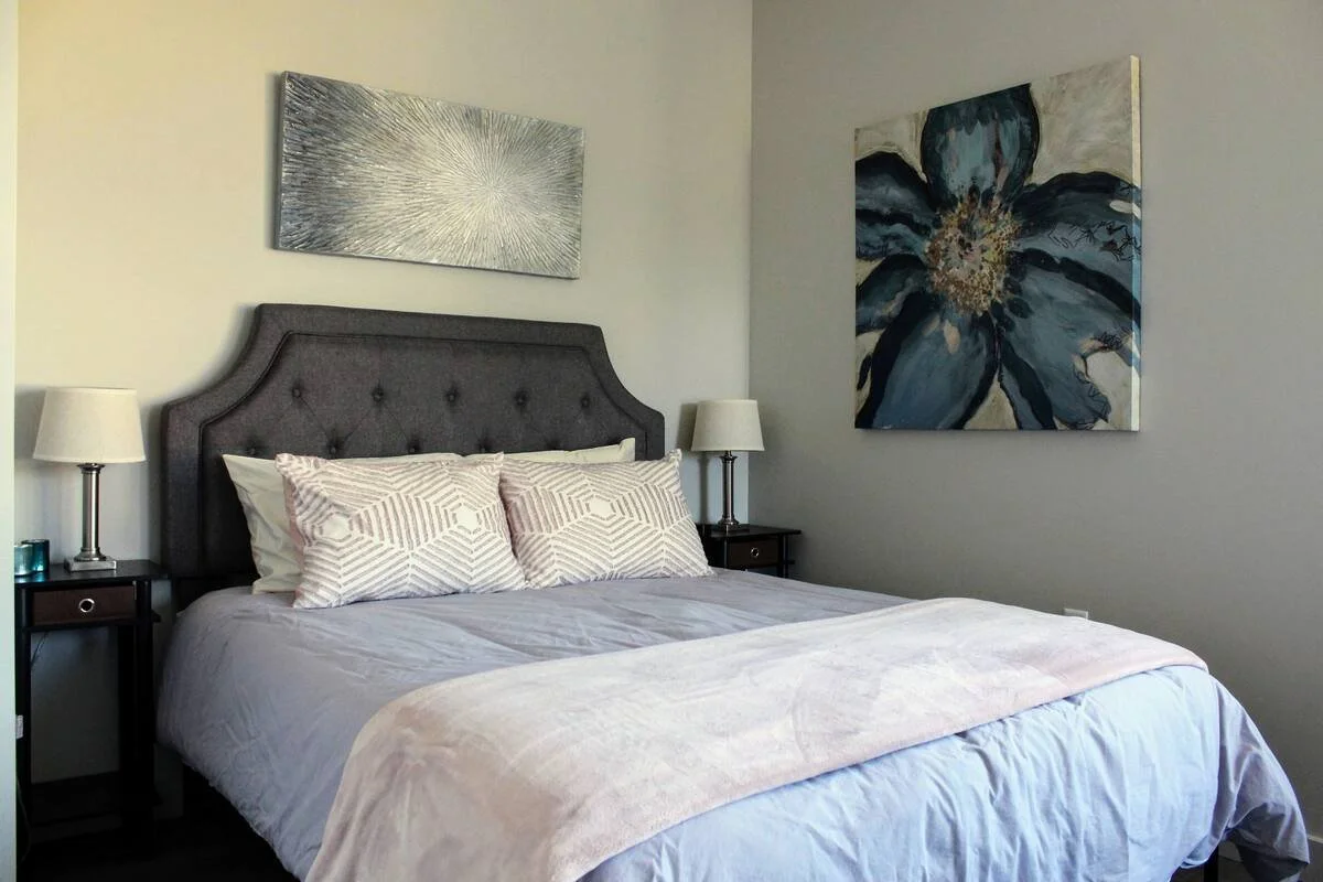 A clean and comfy room with queen size bed.