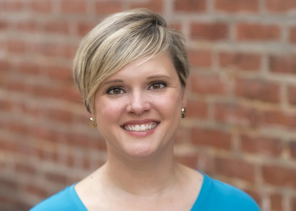 Headshot portrait of Resumoxie founder smiling