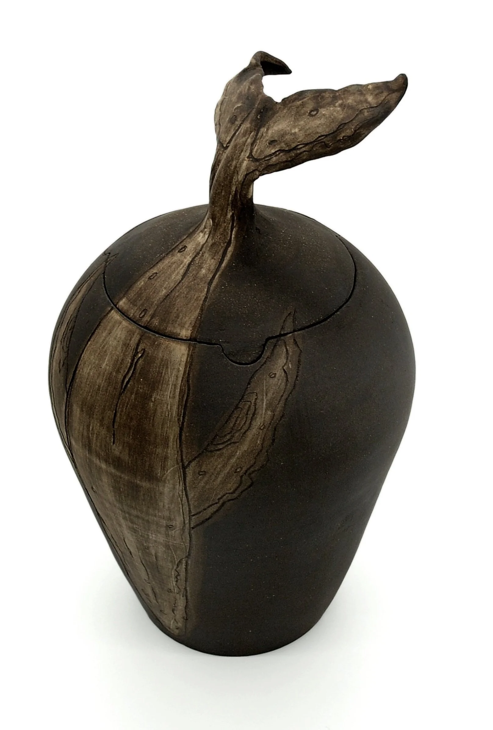 Black ceramic vase with a whale tail lid