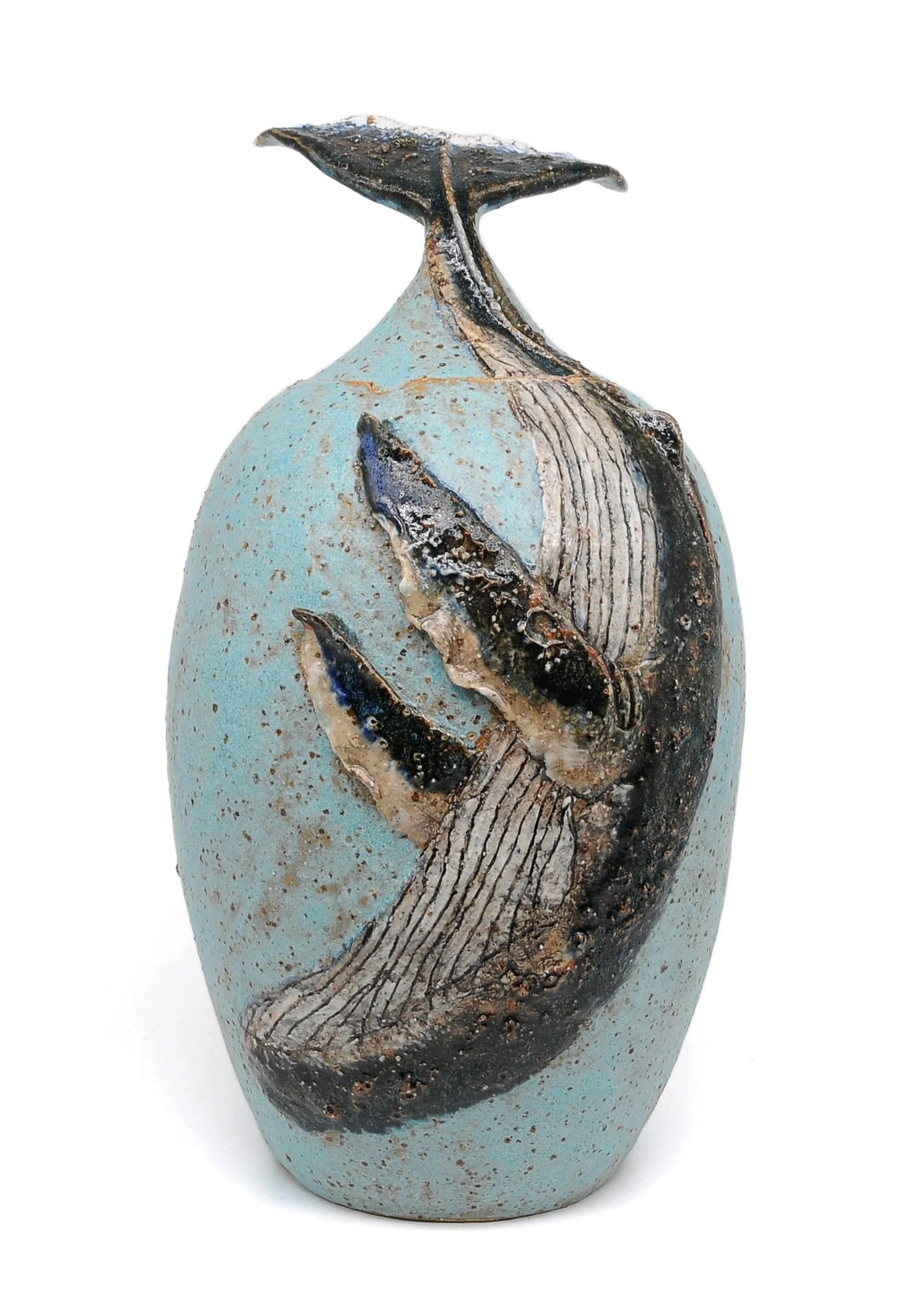 Ceramic vase with whale sculpture design