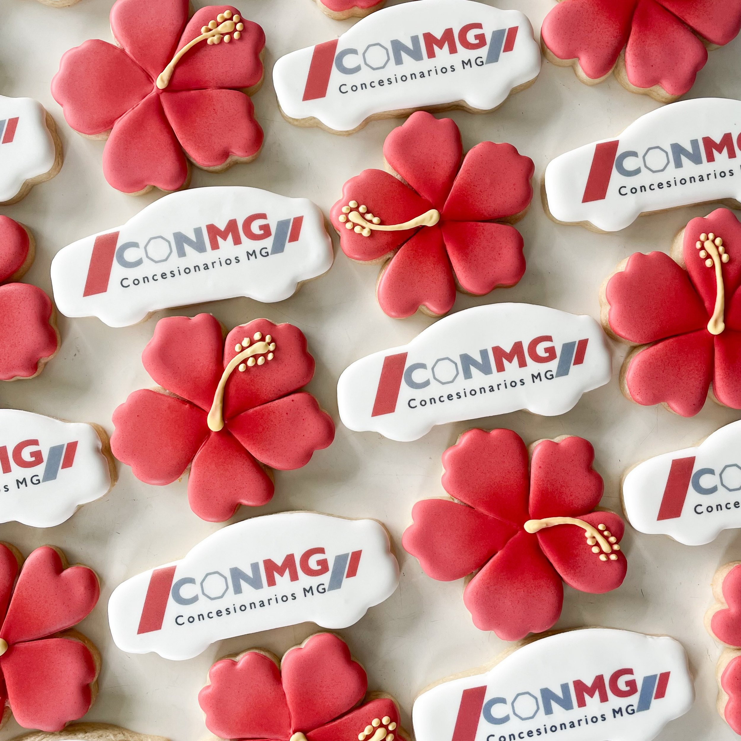Custom logo cookies + vibrant hibiscus cookies = the perfect pair. 
.
.
.
#customcookies #sugarcookiesoahu #logocookies #corporatecookies #hibiscuscookies