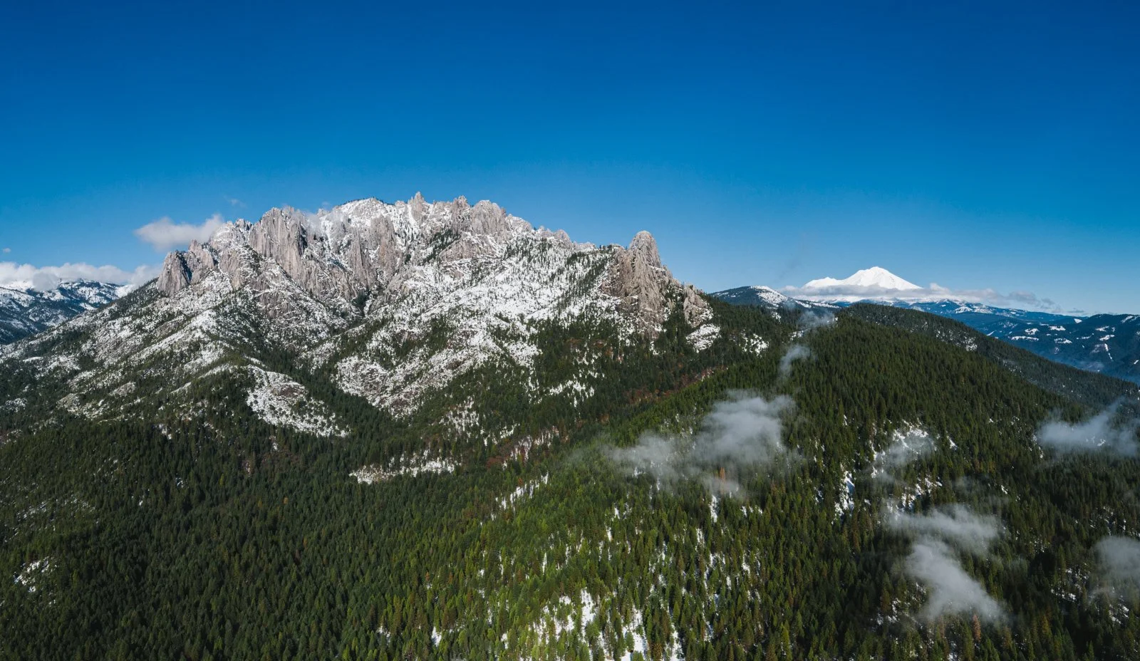 Castle Crags and the forest in the snow.
