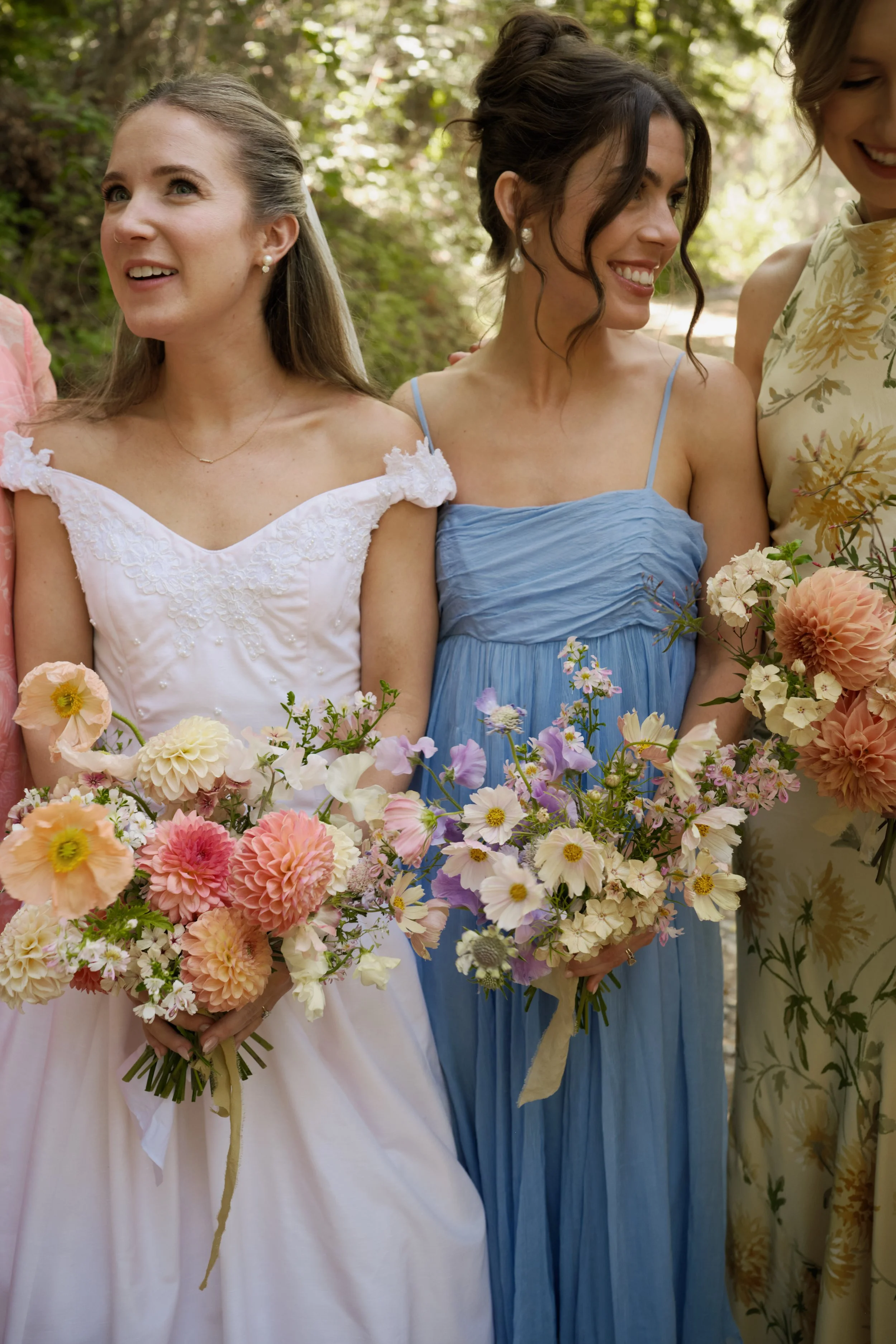 bride with closeup of dahlia bridal bouquet
