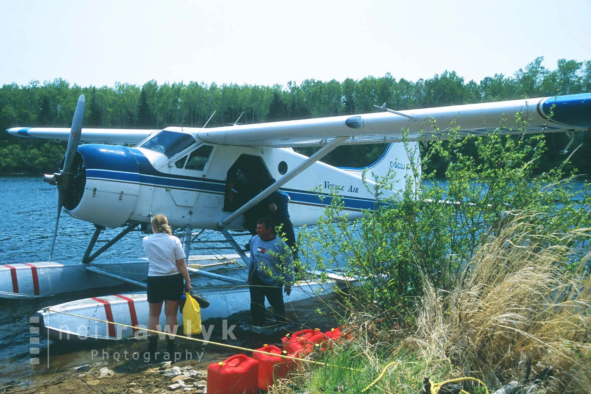 Loading a Beaver float plane on a lake