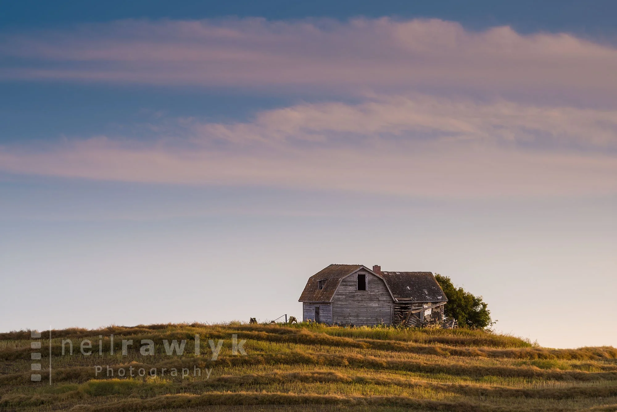 An Old Farmhouse on a Hill