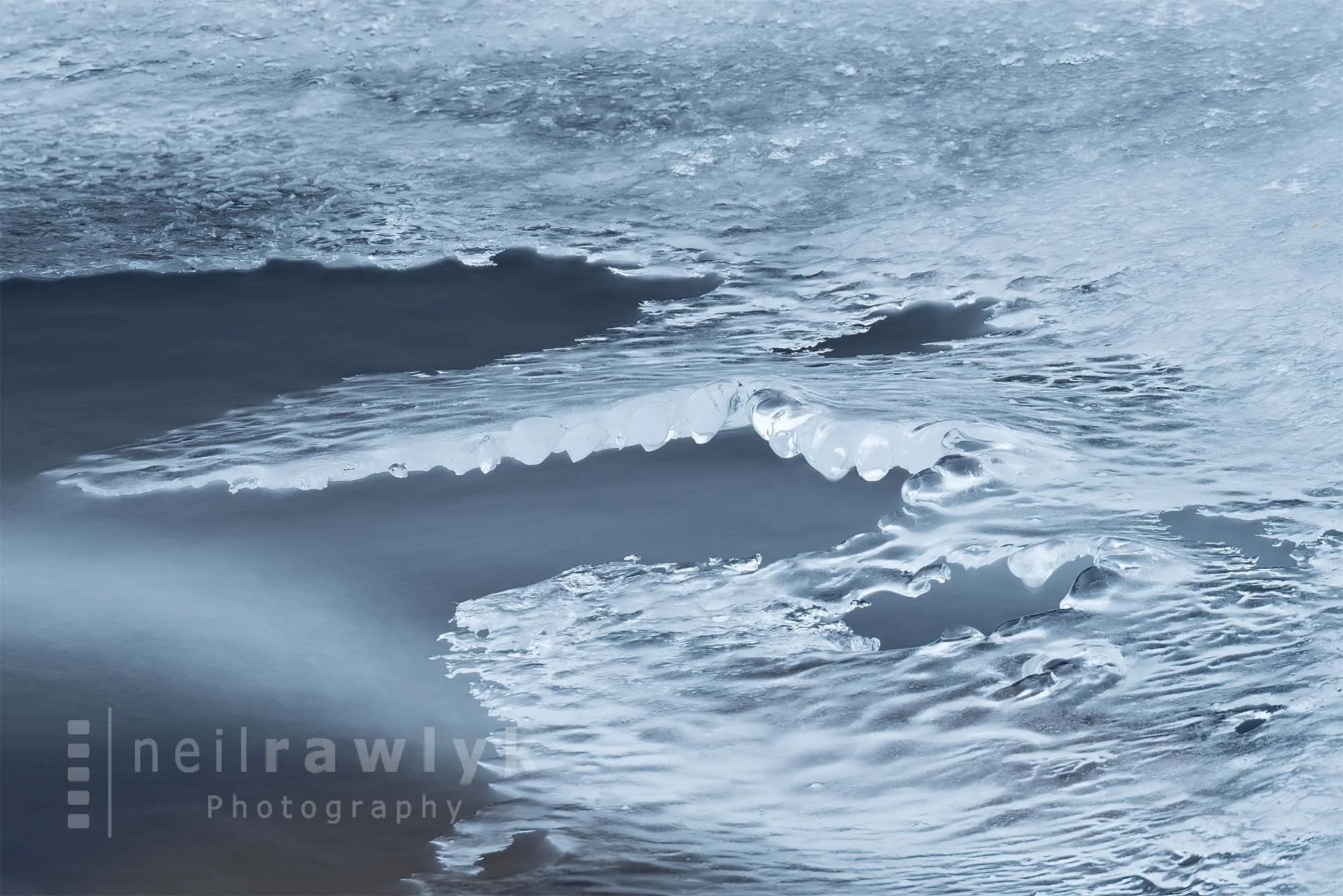 Delicate Ice Formations over Running Water