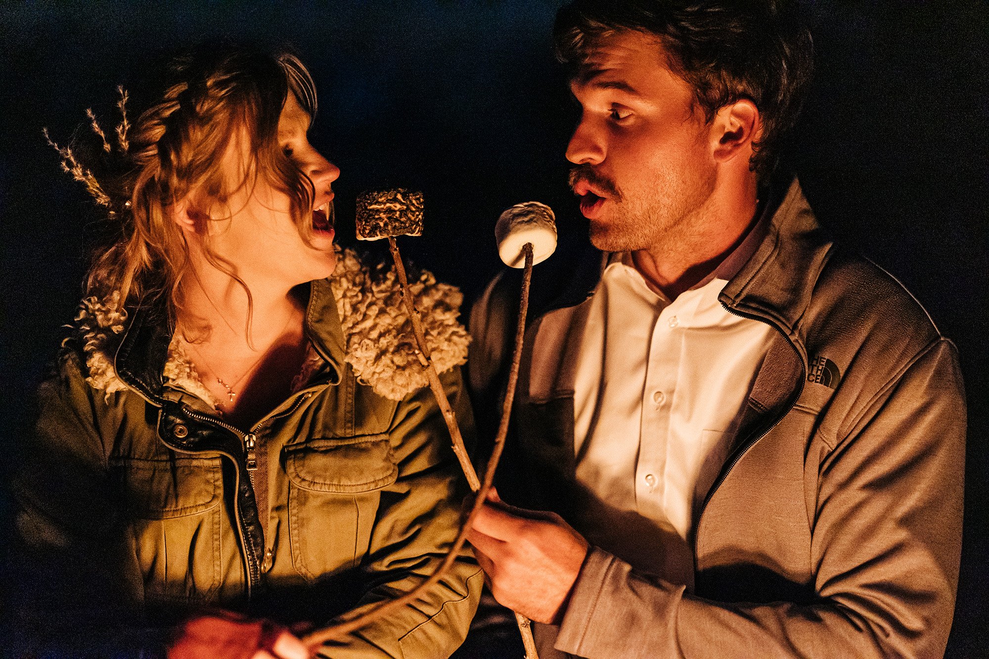 Jill and Drew share s'mores after eloping in Utah.