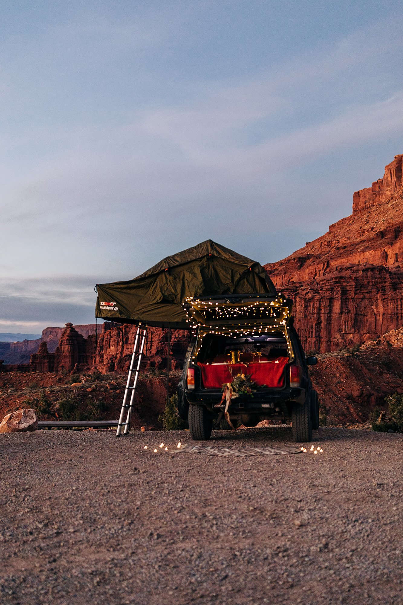 An offroading vehicle with a tent at a campsite in Moab, Utah.