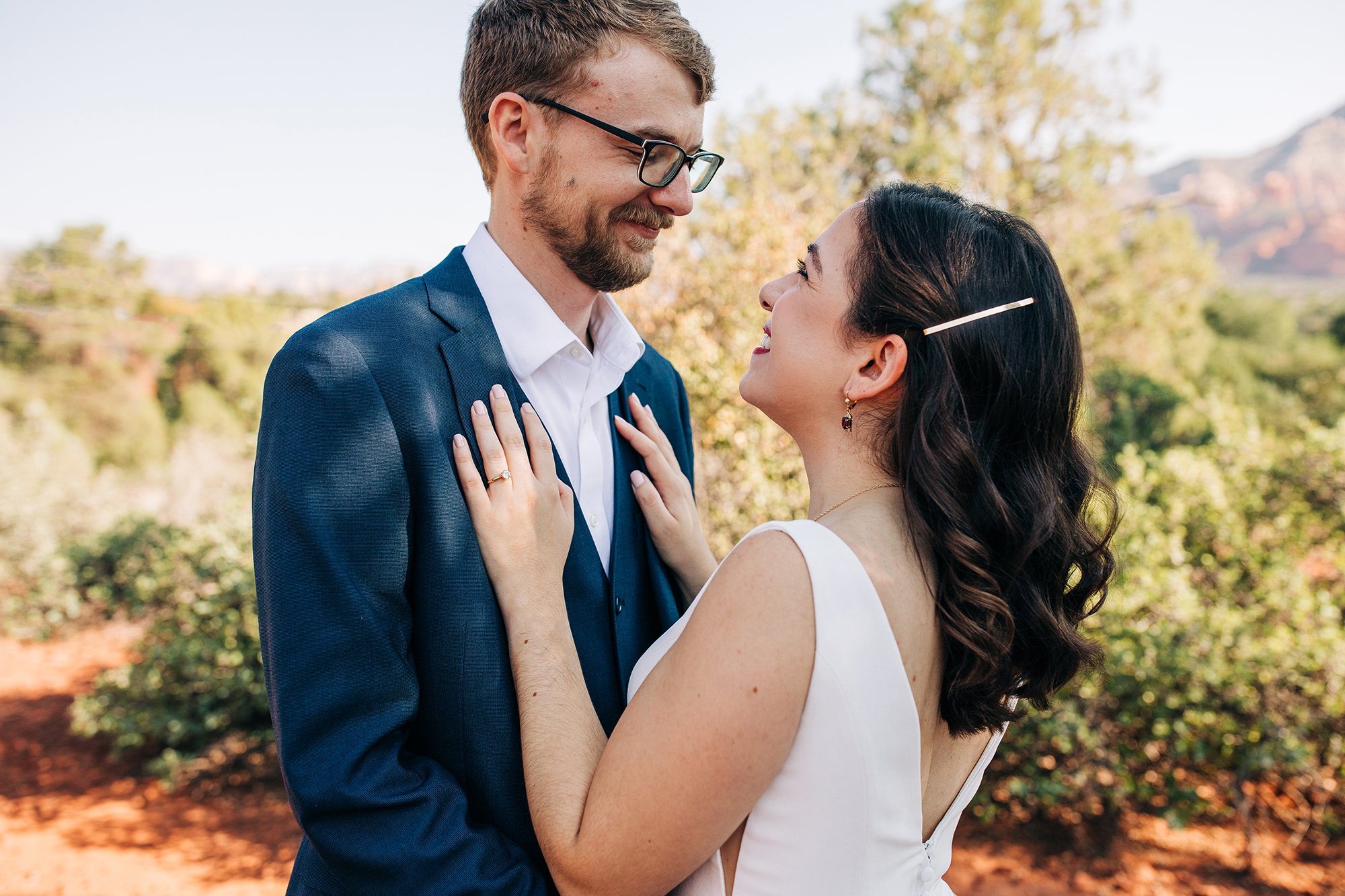 Steph and Matth look lovingly into eachother eyes during their elopement in Sedona Arizona