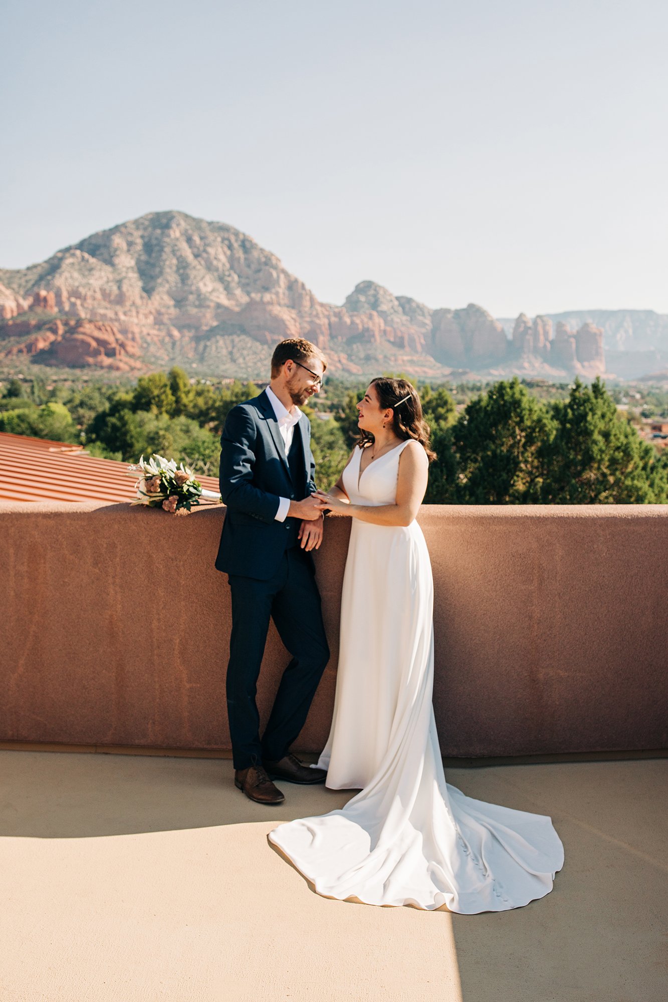 Steph looks into her groom's eye, while Sedona's mountains loom in the background