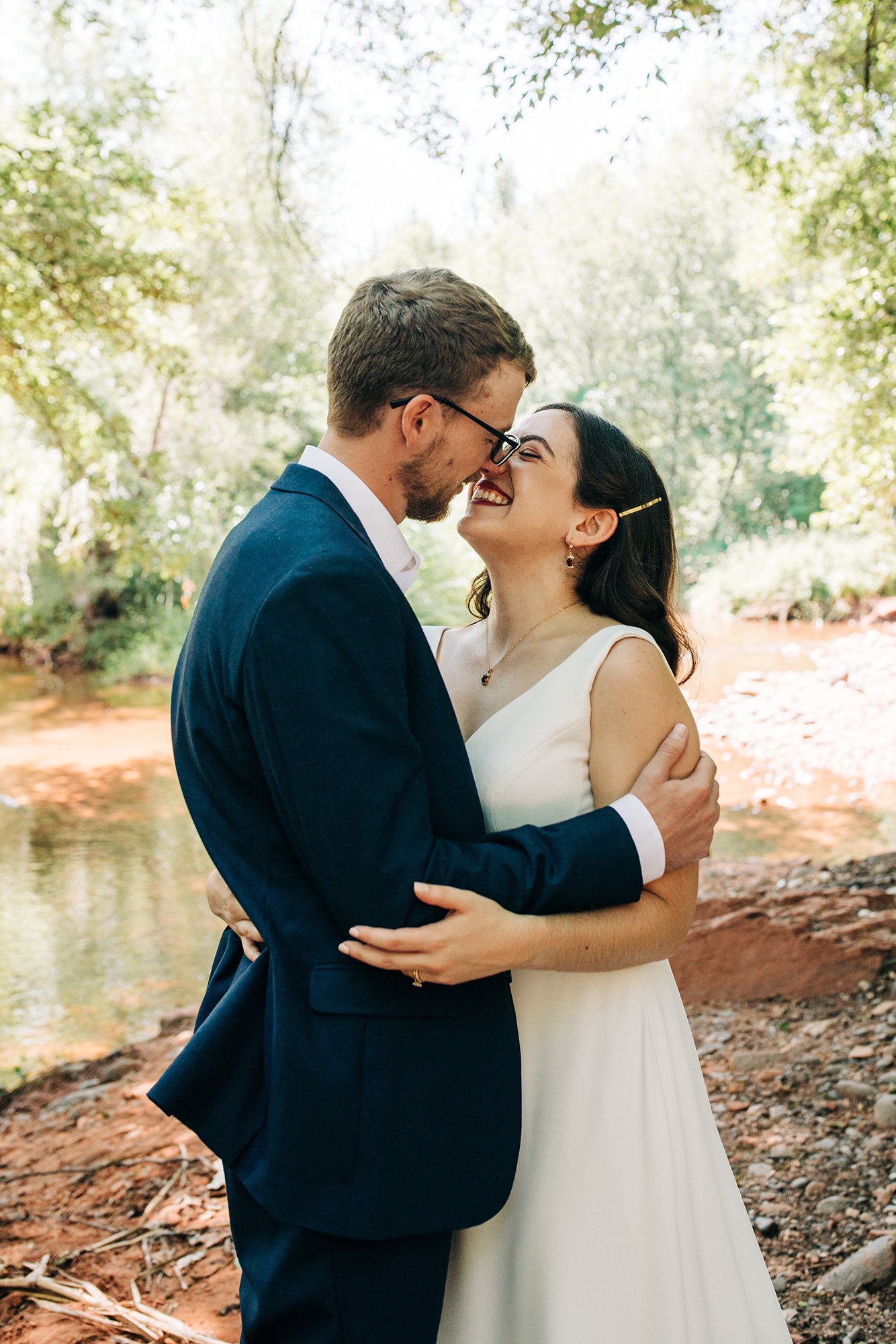 A loving embrace for two newly weds during their sunny Sedona elopement