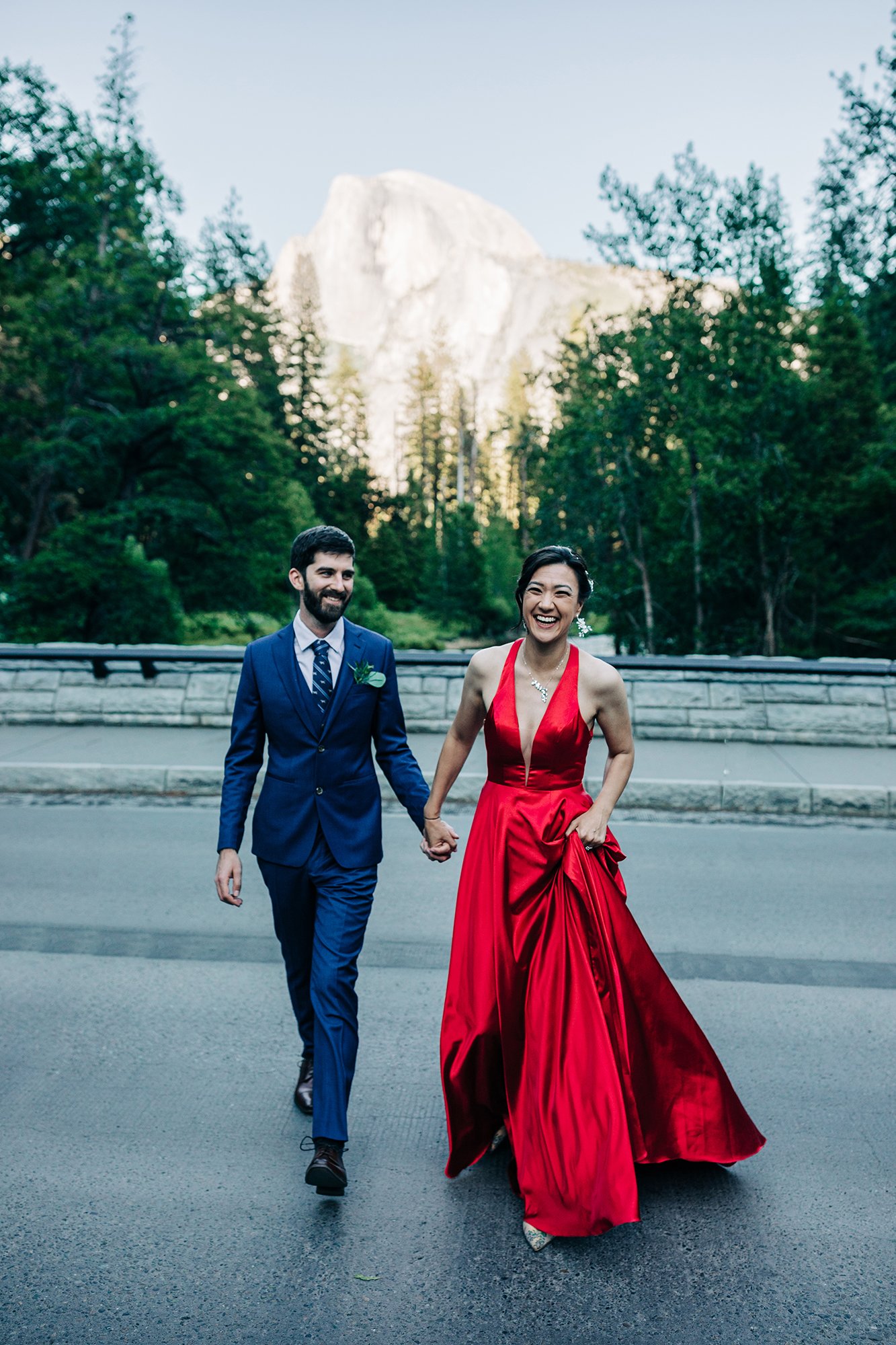Yooree and Jarrod cross the street during their elopement in Yosemite National Park.