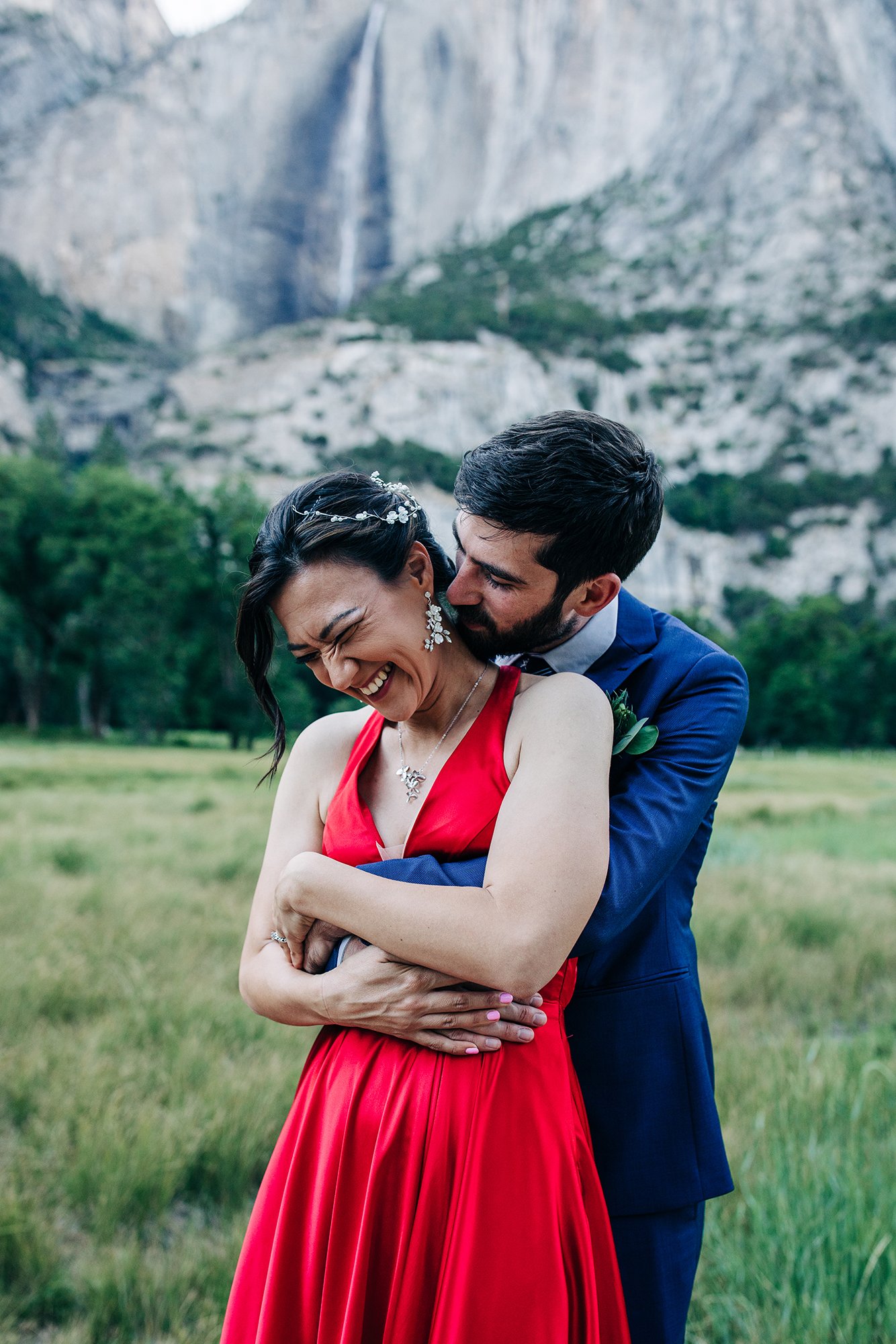 Yooree and Jarrod cuddle during their elopement in Yosemite National Park.
