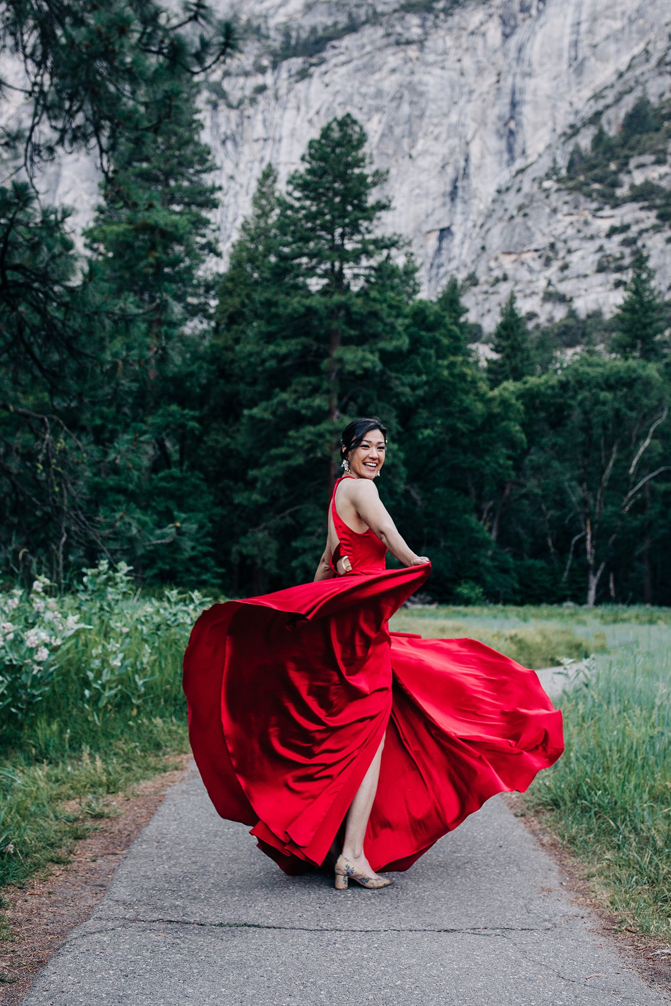 Yooree dances wearing a red dress in Yosemite.