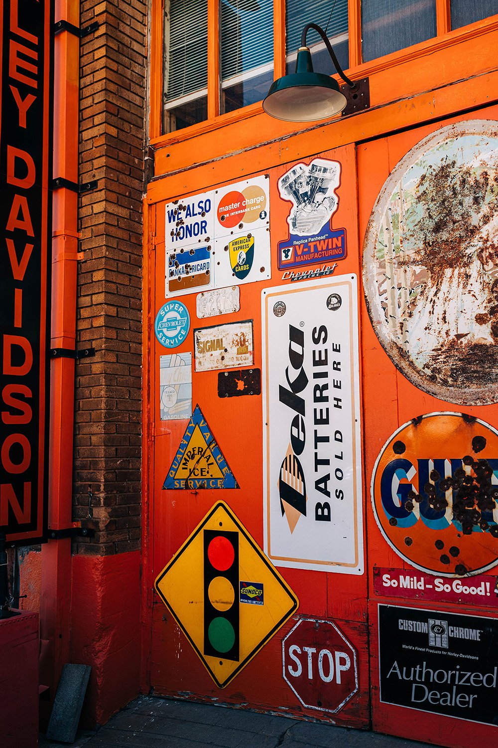 Retro signs on an orange door in Bisbee, Arizona. 