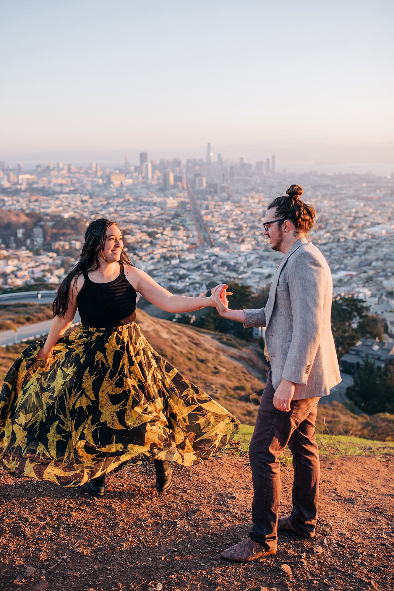 Sean and Diana dance on Twin Peaks in San Francisco during their engagement session.