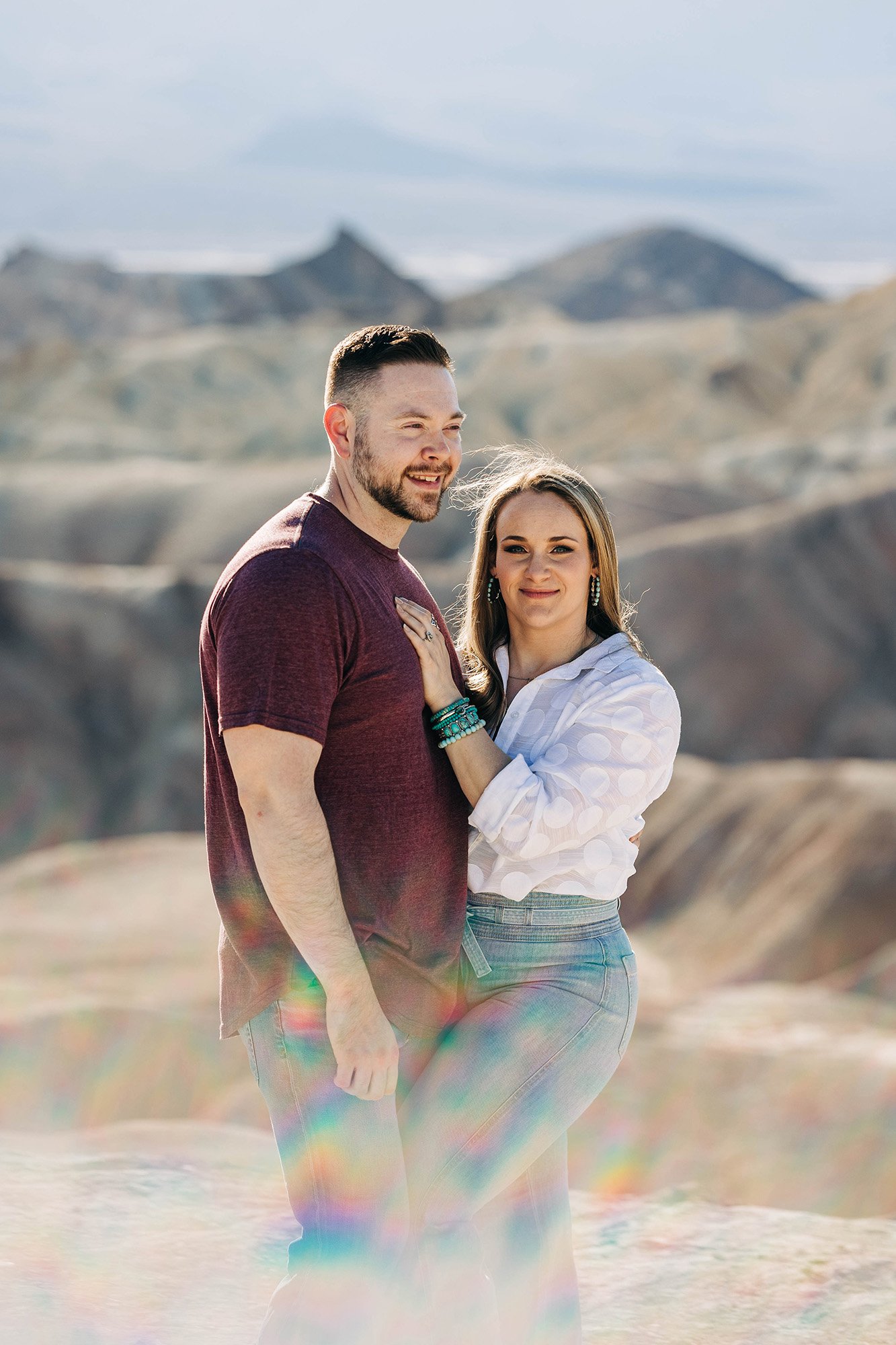 Aly and Alex pose with a sun flair in Death Valley National Park.